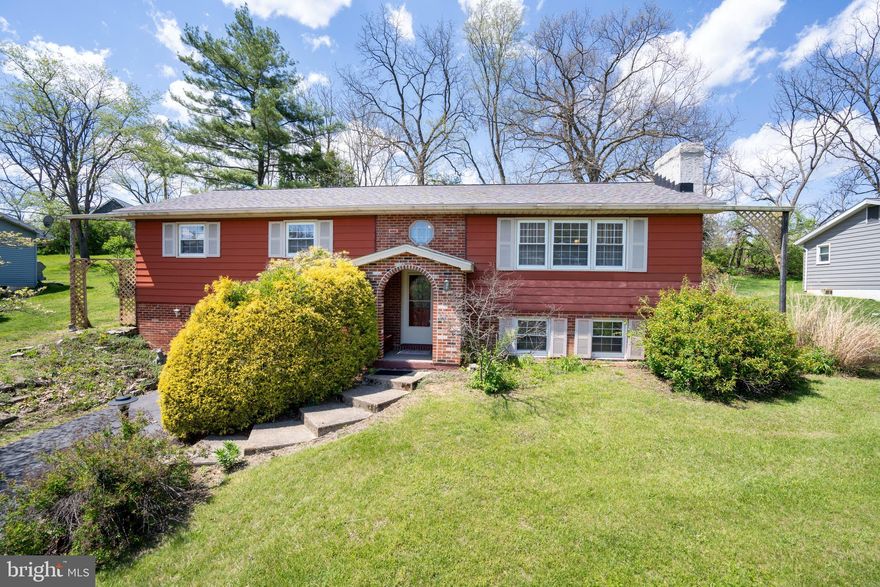 Perfectly positioned to capture sweeping views of iconic Mt. Nittany, this one owner solid split entry offers a rare opportunity to own a front row seat to the beauty & energy of Happy Valley, paired with everyday convenience in one of State College’s most desirable locations. Upon arrival, you’ll be greeted by lush, mature landscaping that sets a welcoming tone.  Inside, the spacious living room features a cozy stone wood burning fireplace, luxury vinyl plank flooring & a large picture window that fills the space with natural light. The well equipped kitchen offers solid oak cabinetry & included appliances, flowing seamlessly into the fabulous dining room where a vaulted ceiling, skylights & a wall of windows create an ideal gathering space for family and friends.  Glass French doors open to the sun sational sunroom, complete with a skylight, a handy separate storage area & sliding glass doors that lead to the rear deck & private backyard. Down the hall, you’ll find a full bathroom with tile flooring & a walk in shower, two bedrooms with oak hardwood flooring & a home office with LVP flooring. The primary suite features oak hardwood flooring, a walk in closet & a private full bathroom with a huge walk in shower & a hot tub.  The lower level boasts a 16x12 finished family room with a brick wood burning fireplace, a dedicated laundry area with storage & another full bathroom perfect for guests to enjoy their own space. Additional amenities include six mini split heat pumps (heat & AC), electric baseboard heat, double pane replacement windows, Central Vac & a one car integral garage.  All of this comes together in a truly beautiful location with effortless access to 322/I 99, shopping, popular local eateries, vibrant downtown State College, and all the energy of Penn State University a setting that continues to shine year after year.  PROPERTY IS BEING SOLD AS-IS.