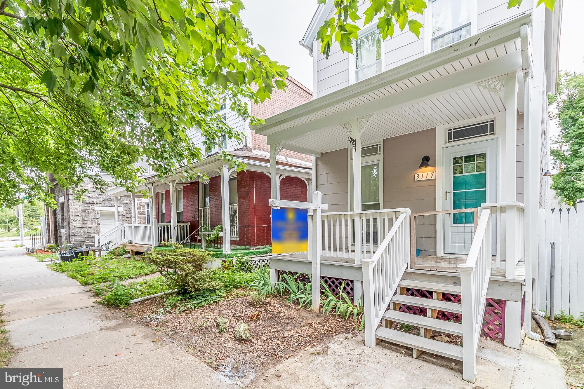 Completely and beautifully renovated (2020) detached, 2+BR/2BA porchfront circa 1900 Victorian home in the coveted Abell community of Charles Village. Open floorplan on first floor boasts wood floors, a charming Living Room, and an unencumbered Dining Room beside the gorgeous Gourmet Kitchen with stainless steel appliances, granite countertops and an oversized island fit for a chef. Two bedrooms each with ensuite Bathrooms, plus full-size stacked front-loading Laundry on second floor. Primary Bedroom has its own private balcony overlooking the backyard. Bonus Room/Office/optional 3rd Bedroom on third floor. Fenced back yard, expansive deck, and private parking pad. Walking distance to the Waverly Farmers' Market, shops, restaurants, parks, Johns Hopkins University, and more. Welcome to your new home!