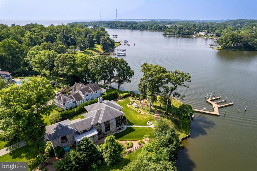 A Rare Opportunity on Milvale Road and Mill Creek.
This exceptional waterfront property, crafted by renowned builder Lynbrook  Homes and thoughtfully designed by architect Vince Green, offers a rare blend of luxury and serenity. The open-concept floor plan is designed to maximize the sweeping, panoramic views of Mill Creek, with western exposure providing breathtaking sunsets year-round.
Spanning three beautifully finished levels, the home is connected by an elevator and showcases designer touches throughout. The gourmet kitchen is a chef’s dream—outfitted with top-tier appliances and ideal for both grand entertaining and intimate gatherings.
The luxurious primary suite is a private retreat, featuring a spa-like bath with a soaking tub, oversized shower, and dual walk-in closets.
Outside, the 250-foot shoreline is secured by a new seawall (2021), while the private pier is a true highlight for boaters: four slips, a 12,000-pound boat lift, three jet ski lifts, and an impressive 8 feet of mean low water depth.  Other important features include, Geothermal heating and cooling, propane fireplaces, state of the art water treatment system, 50 KW generator and additional lot across the street.
More than a home, this is a private resort-style sanctuary—designed for those who demand the very best in waterfront living.