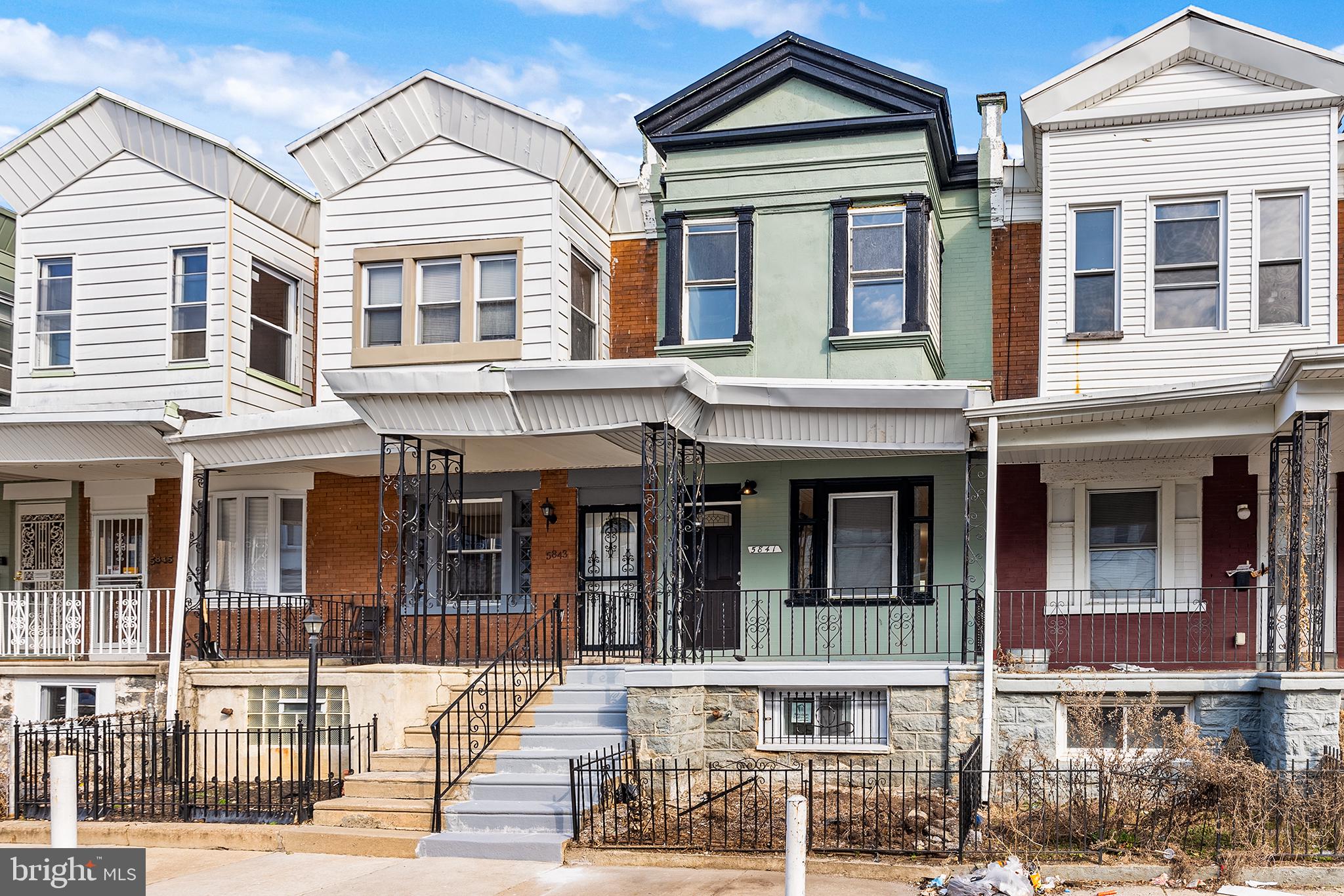 This completely renovated rowhome in Cobbs Creek has three bedrooms on the second floor and a room in the basement which could be a 4th bedroom!! Enter from the covered front porch into a bright, open concept floor plan with hardwood floors. The living area flows into the dining area and then right into the updated eat-in kitchen. Stainless steel appliances, a tile backsplash, Quartz countertops, white cabinets and an island with seating makes the kitchen the show stopper of this home. Upstairs you will find three spacious bedrooms with hardwood floors and lots of natural light. An updated full hall bathroom with beautiful tile work completes this level. The fully finished basement has a flex room which could be a 4th bedroom plus a full bathroom and the laundry. Schedule a showing today!