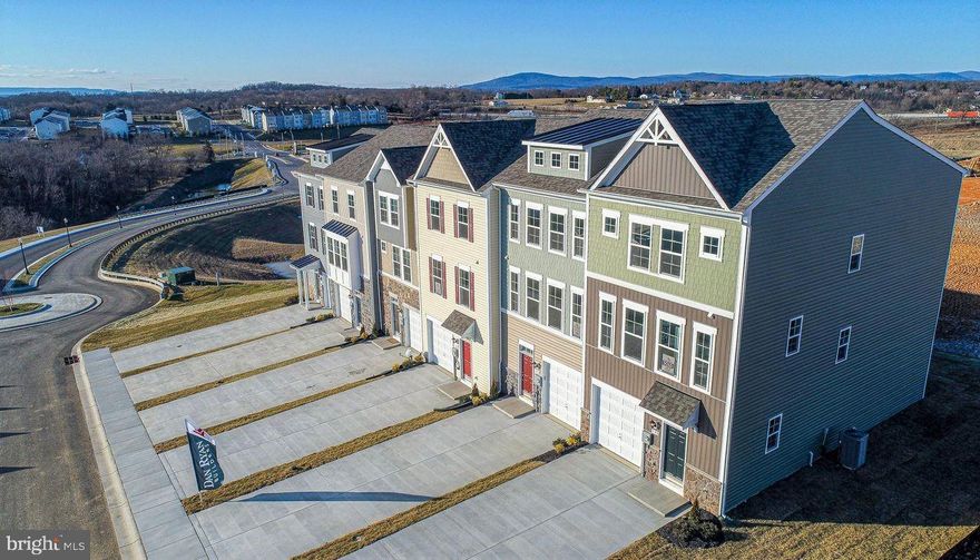 You'll love the flexibility of this wonderful three level townhome. The attached garage opens directly into your foyer offering protection from the rain and snow. You ll also find a handy coat closet adjacent to the front door. Up one level is the heart of your home including a gracious living room with open country kitchen at the rear. Add an island with breakfast bar for more seating and work space. There's even a sunroom loaded with windows! The top level is for you and family with a generous owner's suite tucked away at the back, two secondary bedrooms at the front and a hall bath and linen closet in the center.