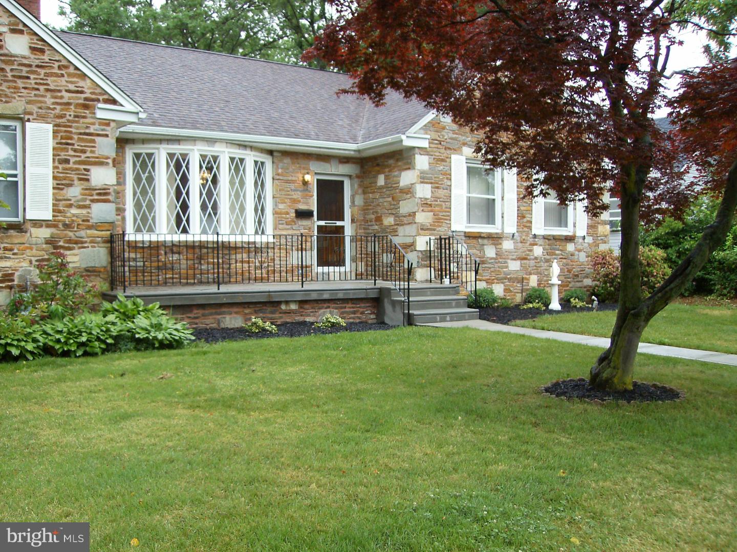 This beautiful 5 bedroom home is in move in condition. Enjoy a brand new kitchen with granite countertops and all new appliances.  An in-law suite with 2 bedrooms in the lower level with a full kitchen and outside exit along with lots of storage. A wonderful new front patio and a large rear yard with a garage and shed for storage. Beautiful hardwood floors throughout;9 foot ceilings and marble floor in the dining room. Plenty of storage in the walk-up attic. The laundry room includes washer and dryer. There is baseboard heat and central air. Cedar closets throughout with a security system and new roof. A LOT FOR YOUR NEEDS!