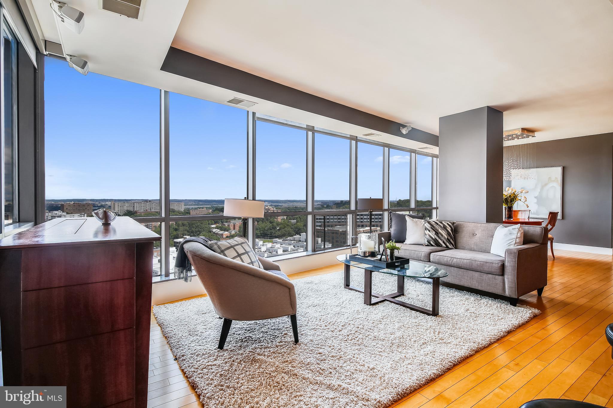 Luxury living meets iconic views in this rarely available 3-bedroom, 3-bath residence perched on the 11th floor of The Odyssey—one of Arlington’s most distinguished condominium communities. From every exterior room, floor-to-ceiling windows showcase sweeping, unobstructed views of the Potomac River, DC skyline, and national monuments—an unforgettable backdrop for everyday life and for special occasions like Fourth of July fireworks. Designed for effortless living and entertaining, this expansive corner unit offers an open layout and a 33-foot wraparound balcony for seamless indoor-outdoor flow. The chef’s kitchen is a showpiece, featuring a 9-foot island, Sub-Zero refrigerator, stainless steel Viking and Wolf appliances, and a dual-zone under-counter wine fridge. Additional upgrades include hardwood floors throughout, a custom 6-foot wine rack, and a dual-zone HVAC system with Nest thermostats. The primary suite is a serene retreat with a spa-inspired bath, jetted soaking tub, separate shower, double vanity, and a walk-in closet with custom built-ins. A full-size washer/dryer, dedicated storage unit, and two assigned garage parking spaces complete the package. The Odyssey offers a full suite of luxury amenities rarely matched in Arlington: Residents enjoy a rooftop fitness center and heated pool with panoramic city views, a landscaped terrace with BBQ grills, a resident lounge, and multiple gathering spaces including a business center, executive conference room, and party room with kitchen and billiards table. Additional perks include 24-hour concierge service, valet dry cleaning, Wave Lounge access, and complimentary WiFi in common areas—all within a secure, video-monitored building with garage parking and controlled access.
Located in the heart of the Courthouse neighborhood, this home boasts a Walk Score of 96. The Courthouse Metro station is just steps away, offering direct access to DC, Amazon HQ2, and beyond. Walk to nearby Clarendon and Rosslyn or explore the neighborhood’s tree-lined streets, weekend farmers markets, local cafes, fitness studios, and parks—all while enjoying a quieter, more residential vibe. The owner will consider one small dog with a refundable deposit. This is upscale urban living at its finest—refined interiors, world-class amenities, and views that define the Washington experience. Tenant is responsible for nonrefundable move-in fee ($600 weekdays, $700 Saturdays) plus $500 damage deposit (refundable). All Allegiance Property Management residents are enrolled in the mandatory Resident Benefits Package (RBP) for $55.95/month which includes liability insurance, credit building to help boost the resident’s credit score with timely rent payments, up to $1M Identity Theft Protection, HVAC air filter delivery (for applicable properties), utility concierge service making utility connection and home service setup a breeze during your move-in, resident rewards program, on-demand pest control (optional), and much more! If resident chooses not to have on-demand pest control, the RBP cost will be $40.95. More details upon application.