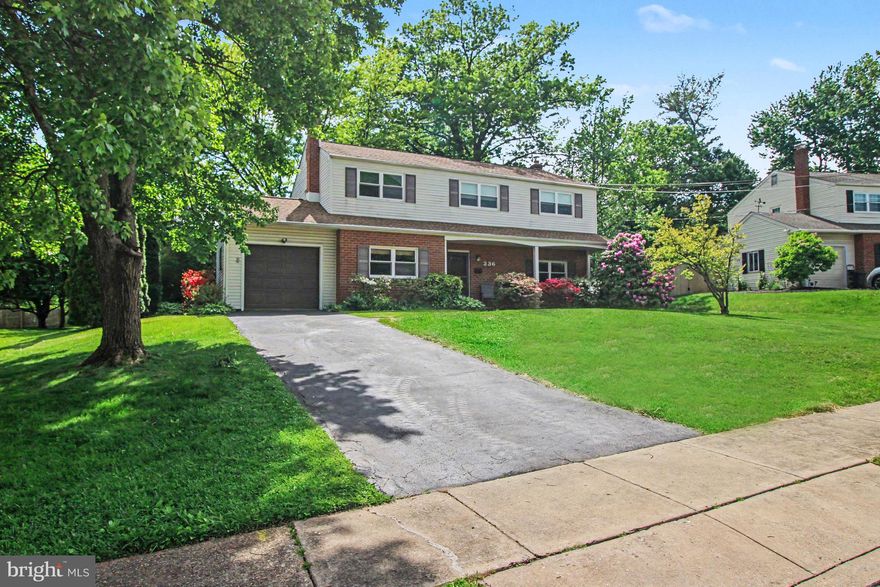 Here is your opportunity to own a well-cared-for home in a great neighborhood in Plymouth Township / Colonial School District. This 4 Bedroom 2.5 Bath Colonial is ready for its next chapter! Pulling up to the home, you will take note of this stately brick and vinyl-clad home with an attached one-car garage. The roof is about ten years old with gutter guards. There's also a Generac Generator that powers the entire home during outages. Head up the walk to the front covered porch, and let's enter the home. Standing in the foyer, to your right is the formal living room, where carpets have protected the original hardwood flooring. Windows throughout the home, were replaced in 2005. Wrap around the Living Room to the Dining Room, situated off the rear expansive Kitchen.  Here you will find solid oak cabinets, a ceramic tile backsplash, a gas cooktop, and a pantry. This is an Eat In Kitchen and truly the heart of the home! Just off the kitchen, a convenient Laundry Room with a slop sink and side door access for easy access. Rounding out the first floor, inside access to the 1-car garage, a powder room for guests, and a Family Room with a brick, wood-burning fireplace.  Having finished up the first floor, let's head downstairs to the lower level. You will find that half of the basement has been finished. Owners have had the home professionally waterproofed by BQ Basements, two sump pumps, and a dehumidifier. Newer gas water heater 2022. Brand New Sewer Lateral May 2026. HVAC with April Aire Humidifier 2017. The extra shelving and built in cabinets are to remain for your use. Now, sojourn up to the second floor. Again, we find carpeting has protected the original hardwood flooring. You will find four good-sized bedrooms. The main bedroom features an en suite bathroom with a shower, updated nicely with limestone tile. We are not done yet, there is a full attic, partially floored,  with sheets of plywood for additional storage and a whole-house attic fan.  Owners are sad to move onto their next chapter, but are excited for new owners to make this home truly their own. Make an appointment today!