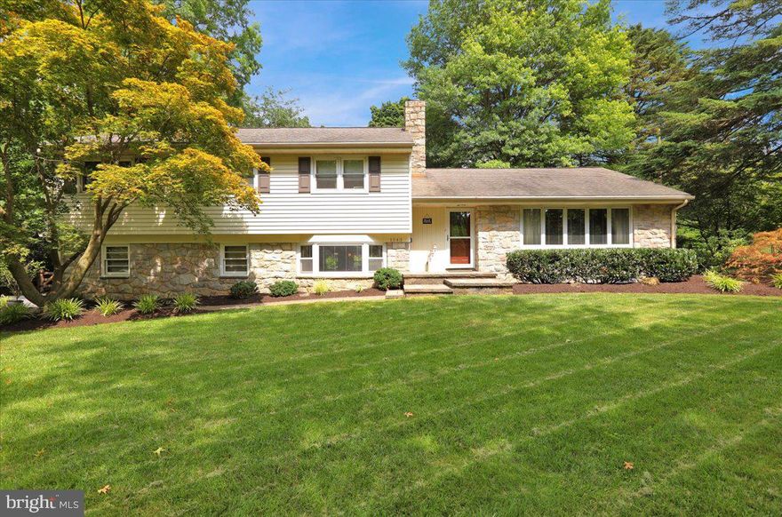 Classic Wyomissing sprawling split-level on a lovely tree-lined street in Birdland is where you’ll find this gem, sitting on a spacious and private .50-acre lot, fully fenced in yard.  Surrounded by lush mature landscape and a lighted hardscaped walkway and entrance leading to the front door and extensive hardscaping with multi-level patios all surrounding a stunning heated gunite black-bottom pool in the back yard.  This back yard has the 'wow' factor!   Inside, you’ll appreciate the classic feel of this home, mingled in with current decor starting with the flagstone tiled entrance and hardwood floors which run throughout the home.  The living room is large with a bay window to allow for plenty of natural light and views of the tree-lined street.  This opens to a formal dining room, which flows into the kitchen with a back door leading to the pool and grilling area.  Up a few steps are 4 very generous sized private bedrooms with the primary bedroom having a full private bathroom.  The hall bath is also located on this level.  A few steps down is the family room with a gorgeous stone wood burning fireplace, bar area and another door leading out to the pool area.  A half bath is close by for a quick trip from the pool, as well as an office and access to the garage.  Down one more level is yet another finished off area, perfect for another hangout area or gym area, as it is currently being used.  A nice sized storage/laundry room is also located on this level.  You'll appreciate the brand-new high efficiency HVAC system and brand-new roof. This home is much larger than it appears from the outside so whether you’re entertaining your guests inside or outside, Christmas parties or pool parties, this is the perfect family / friends gathering spot!