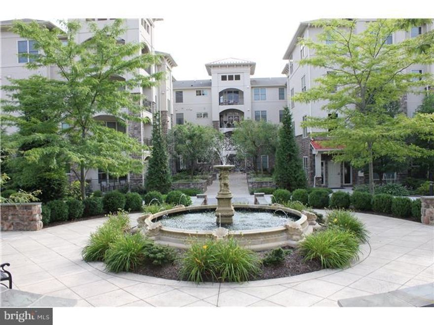 Perfect opportunity to own a luxurious home at Terrazza at Newtown Square.   Terrazza offers luxury and worry free living with all the amenities including a club house with full fitness center, billiard area, pool, sauna, and tennis.   This 2 bedroom 2.5 bath corner home is the best value at Terrazza boasting the best location in the community.   The corner terrace overlooks  the elegant Terrazza courtyard and adjacent woods.  Immediately upon entering the entrance foyer you will note the bright open layout of this home featuring wood floors,  gourmet kitchen with granite tops, stainless steel appliances, under cabinet lighting, crown molding and living room with gas fireplace.   French doors off the great room open to the large corner terrace to enjoy your morning coffee while enjoying the tranquil view.     The master bedroom features a large walk-in closet, Master bath with soaking tub, double vanity and oversized shower stall.  The second BR also features its own bath with and walk in closet.   There is a powder room off the foyer for the use of your guests.  The large open floor plan and dining area can easily handle those family gatherings.   Plenty of extra storage in the full size laundry room with utility sink.   The unit includes one underground parking space and additional storage off the garage area.   This is luxury living at its best.   Its pet friendly  too!  Don't miss this opportunity.   The location is central to the Main Line, center city, Media, Bryn Mawr , the airport and major roads.    One time capital contribution of $1000 due at closing.