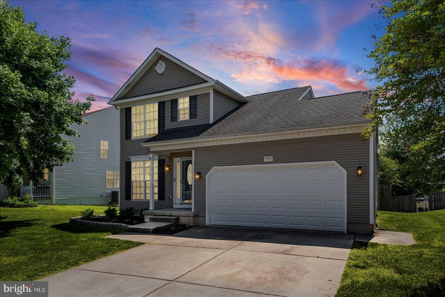 Beautifully maintained and move-in ready 3BR/2.5BA Colonial located on a landscaped lot in the quiet neighborhood of Beacon Point. Pull into the double wide driveway, park in front of the attached two car garage, and enter your new home through the covered front entry.  Step inside a home filled with natural light, a neutral color palette, and luxury tile and carpeting.  The main floor offers an open-concept living room and dining room just steps from the kitchen, dining area, and family room.  The kitchen offers abundant cabinets and counter space, a separate pantry closet, stainless steel appliances, a double sink under a window, and room for a breakfast table.  The carpeted second floor contains two sizable secondary bedrooms, a full bath, and a spacious primary bedroom with a vaulted ceiling, two closets, and a private full bathroom. The unfinished lower level offers you the opportunity to create additional living space according to your family's needs. It includes laundry, storage, and sliding doors leading to an amazing yard.  From the main floor step through sliding doors onto a large wood deck overlooking a fenced yard filled with green space, trees, and so many possibilities.  This move-in-ready home is ideal for any new homeowner and is located in close proximity to shopping, restaurants, and commuter routes.