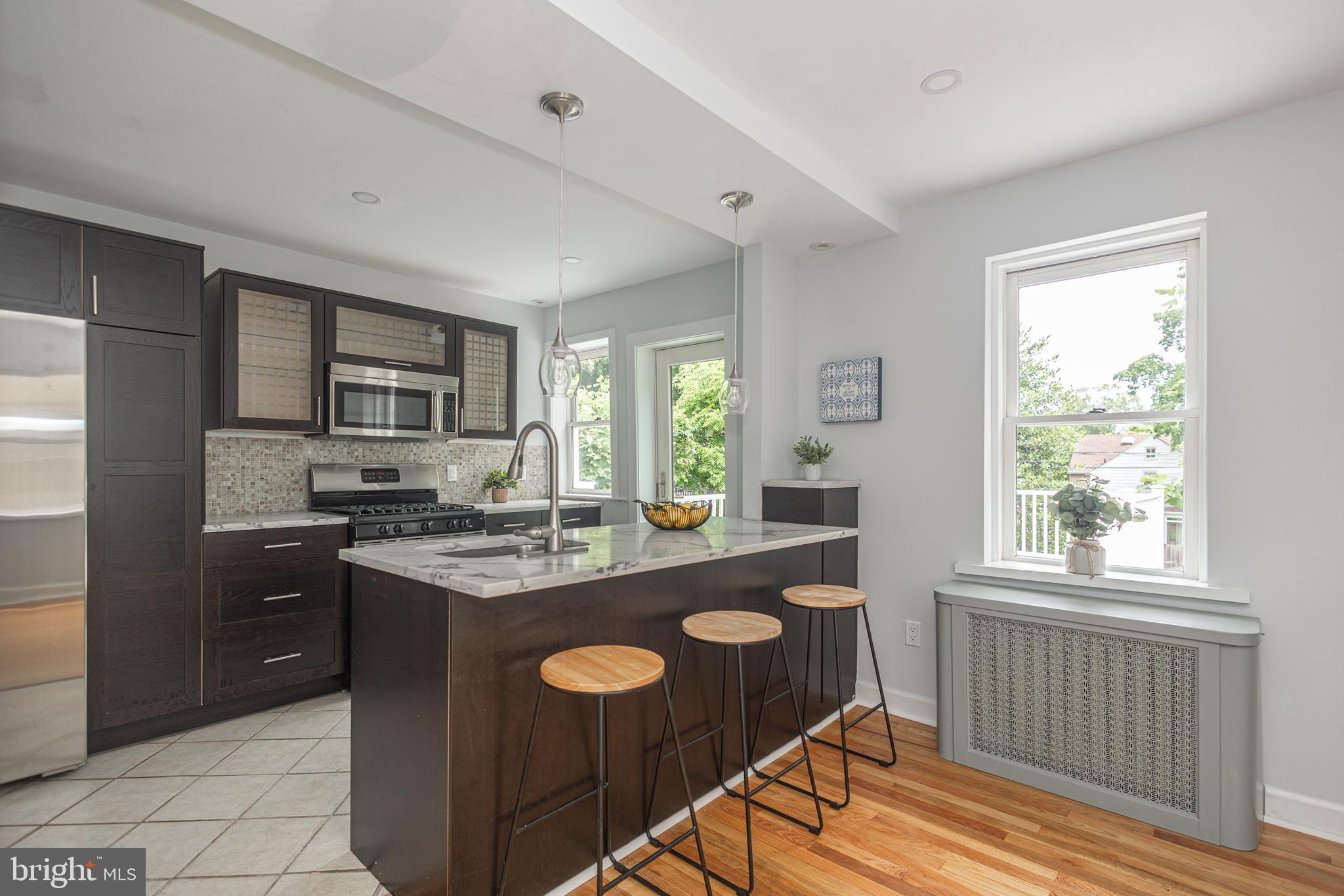 Completely renovated 3 bedroom twin nestled on a quiet cul-de-sac in charming Narberth Boro just minutes from Rt 1, Rt 30 , 476, 76, Narberth Park, and Lankenau Medical Center. Step onto the covered front porch and into the sundrenched living room, complete with gleaming hardwood floors, recessed lighting, and bright windows! The gourmet kitchen boasts brand new quartz countertops, stainless steel appliances, sleek bordeaux cabinets, ceramic tile flooring, recessed lighting, and leads to the elegant dining room. Enjoy your private, fenced-in yard from the huge TREX deck! The expansive walk-out basement is ready to be finished! The lovely bedrooms upstairs feature glistening hardwoods, new paneled doors, black door knobs & hinges, large closets, recessed lighting , and share a remodeled hall bathroom with new sink, new vanity, new toilet and wide-plank tile flooring! CENTRAL AIR installed in 2023! ONE YEAR HOME WARRANTY INCLUDED! Award-winning Lower Merion School District!