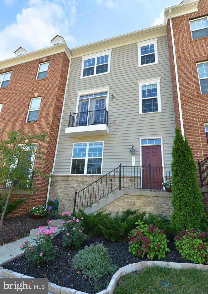 Coming Soon!!! A beautiful townhome featuring spacious interiors and warm design details.