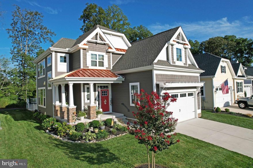 Discover this exquisite coastal-style residence, built in 2021, offering a seamless blend of luxury and comfort, plus the efficiency of OWNED SOLAR currently yielding monthly bill of only $2.28. The open floor plan features a gourmet kitchen with upgraded countertops, an island, and high-end appliances.  Floor plan upgrades include extended dining room, oversized & insulated garage, and outside basement entrance.   Enjoy cozy evenings by the gas fireplace in the spacious living area, adorned with high ceilings and painted beams. This home boasts a thoughtfully designed entry-level primary bedroom and a full basement with potential for customization. Large double-pane windows invite natural light and garden views, backing to a wall of trees. Step out back to relax on the screened porch or grill on your deck.  And sit on the front porch to watch neighbors walk their dogs. Additional highlights include a main floor laundry, attached garage with inside access, and community pool.  Centrally located between Rehoboth Beach & Lewes plus you can enjoy the ease of shopping nearby without venturing onto Route 1.  Experience an exclusive lifestyle in this exceptional property, where modern elegance meets tranquil living.  And YES the electric bill for last 12 months TOTALED $27.36 for the entire year!