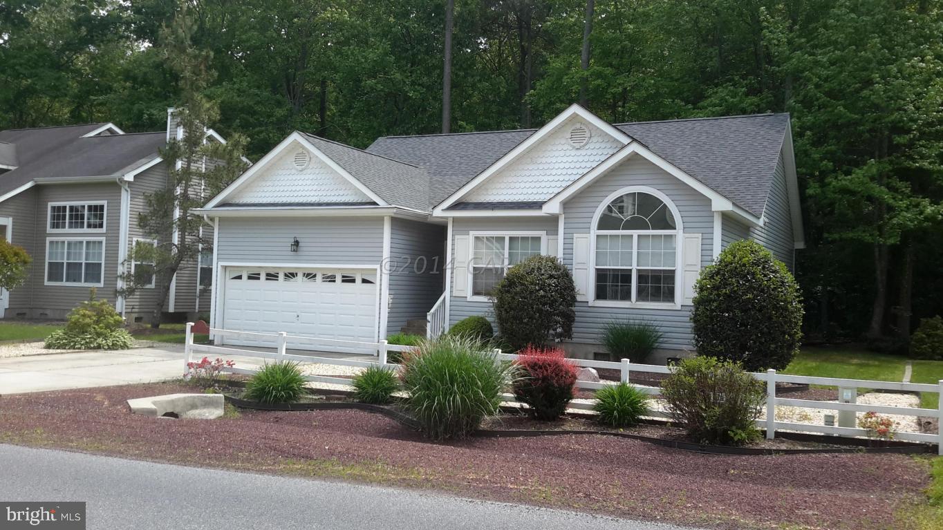 Absolutely move in ready, beautifully maintained and updated home in The Innerlinks in Ocean Pines. In 2010, the home had a new roof, new HVAC, ALL new appliances, gorgeous island added to the kitchen, new tile shower in master bath and the entire interior was painted. Totally open floor plan, backs to quiet wooded area, and has a large screened in rear porch. Fabulous landscaping too! Great location in a newer community in The Pines with all newer homes, walking distance to the Yacht Club, one of the Pines' best amenities - and two pools. Ocean Pines also has an indoor pool, a beach club and pool, many parks and walking paths, playgrounds and a Robert Trent Jones golf course. It truly is the best community on the Eastern Shore!
