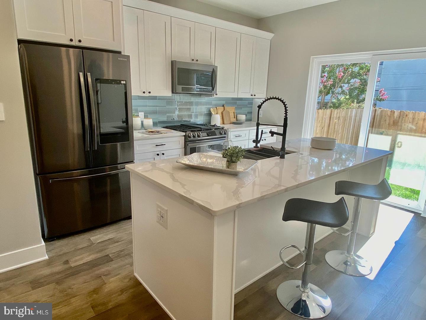 Newer Construction with a huge ROOF-TOP DECK and Fenced backyard! This 3 bedroom 2.5 baths newer construction (built 2022) luxury home has over 2000+ SF. Enter the living room and enjoy this home's OPEN FLOOR PLAN.
<br><br>Low Taxes with a 10 year tax abatement in place until 2032 !<br><br>
<br><br>The chef's kitchen allows you to prepare your dinner party while your guest can mingle in the living room and dining room. The kitchen features black stainless steel Samsung appliances with Samsung Family Hub Refrigerator to manage your daily routine. Quartz countertops, custom island, tile backsplash, farmhouse sink, beverage fridge and black accents finish off this kitchen. Sliding Doors provide access to your fenced back yard - perfect place for entertaining !
<br><br>The huge master suite features two large walk-in closets, two additional closets, a custom wall covering and spa inspired bath. There is plenty of space for you to enjoy your private master suite. The master bath features a large tiled shower, glass shower doors, rainfall shower head and double vanity with lighted mirrors. Exit the master bedroom suite and take the stairs to your private ROOFTOP DECK. Take in the summer nights and relax with your guests in this spacious outdoor space.
<br><br>This home also features led lighting to help save on your electric bill. Smart light switches are installed which can be programmed to turn on and off (can be controlled by Alexa). USB outlets to charge all of your smart devices.
<br><br>LOCATION ! LOCATION ! LOCATION !
Ideally located near the Manayunk train station, bus stops, and Route 76, commuting is a breeze. Enjoy the convenience of walking to vibrant Main Street, with its array of restaurants, boutiques, and the Schuylkill River Trail, plus easy access to other area attractions.
Don’t let this exceptional Move In Ready Home slip away— Schedule your Showing Today ! QUICK SETTLEMENT IS POSSIBLE!