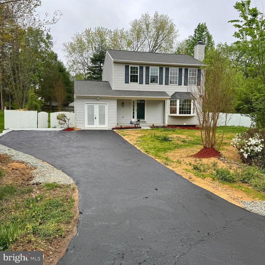 Home features 3 bdrms, 2.5 baths, eat-in kitchen, Electric FP with multi color in LR, french doors & chair rail in formal DR, crown molding -ML and inviting front porch.  New AC unit inner/outer. Brand new - stainless steel appliances, kitchen cabinets and granite countertop. Remote control fan with lights.  All bathroom upgraded with new tiles, light and vanities. All floor luxury vinyl planks. New carpet, water heater, New deck.  Installed more than 3 dozen recessed lights. Freshly painted.  Basement features separate excercise rm or 4th bdrm. Lg fenced yard.