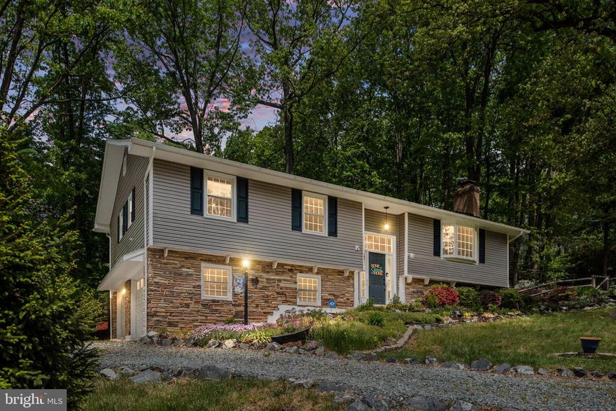 Beautifully Landscaped Corner Lot Near The Front Gate.  Circular Driveway, Fully Fenced Backyard, Side Garage, Firepit Area, Perennials That Line The Walkway To The Front Door, And Storage Shed. Features Include: Vinyl Siding w/Stacked Stone Exterior, Newer Roof and Windows.  Upper-Level Features An Updated Kitchen,  Double Wall Oven, Floating Shelves, Breakfast Bar, Recessed Lighting; Cooktop.  Large Sliding Glass Door Just Off The Dining Room Opens To A Freshly Stained Two Tiered Deck w/Built In Seating. Living Room Bump Out Window, Fireplace Surrounded By Brick,  Owners Suite w/Ceiling Fan And Walk In Closet, Ensuite w/Dual Sink Vanity And Shower.  Completing The Main Level Are 2 Additional Bedrooms And A Full Bath.   The Lower Level Features A Full Bath, 4th Bedroom, Walk-In Laundry Room, Storage Space, And Access To The Garage.  Aquia Harbour Amenities Include A Marina, Golf Course w/Driving Range, Putting Green & World Famous Clubhouse At Aquia Harbour Restaurant, Fishing Pier, 2 Pools, Dog Park, Stables, Tennis Court Basketball, Walking Trails, Community Garden, Police And Fire Departments w/Quick Access to Interstate 95 and HOV Lanes, Quantico And Shopping!