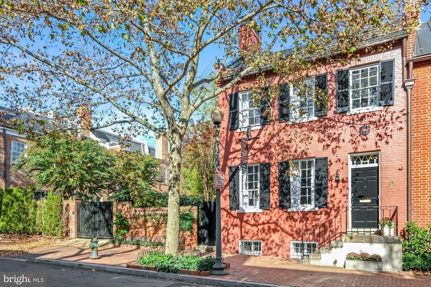 Stately semi-detached 1825 Federal has all the original historic charm, tall windows, abundant natural light, period architectural details throughout with modern amenities.    The exquisite and  lush walled gardens wrap around the home with private patios, mature plantings, water feature  and seating areas that provide private enjoyment with multiple entertaining possibilities culminating at the in-ground,  salt water heated  pool!   Main level boasts formal entertaining spaces and dining room with access to side gardens.  Top of the line kitchen with eat in  island that leads to the family room with 3 sets of french doors that flow to the garden and pool.  New primary bath recently completed.  Lovely 2nd level balcony over looking the garden.  Top level with skylights is perfect for home office or additional bedroom with full bath.  The lower level has exterior access and full bath - ideal for aupair suite.  Private parking space is located just behind the pool-  Location  |. Location.  l.  Location -  East Village - Less than a mile from Foggy Bottom and Dupont Metro.-Ideal proximity to all the cultural attractions DC has to offer or stroll to the local farmers market and all Georgetown has to offer.