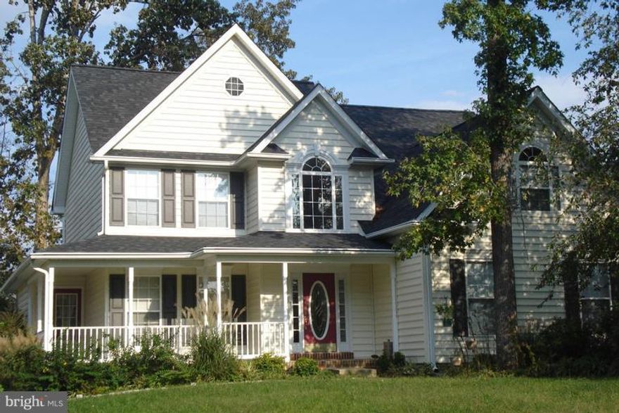 This home says welcome!  Sits on a corner Lot and it is  a huge spacious home and with a wrap around porch.  Very open  floor plan - beautiful kitchen with granite counters and stainless appliances with a jenn Aire island.  Crown molding, chair rail in family room with cozy fireplace, over sized master bedroom w/vaulted ceilings, sitting room, hardwood floors and a 2 car garage.  Fenced in yard.