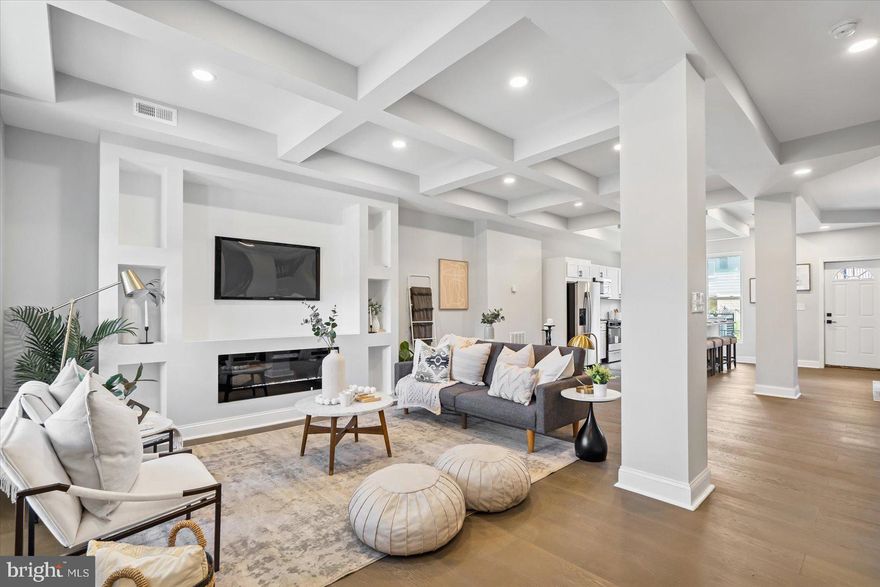 Welcome home to 2320 Arunah Avenue, Baltimore, MD 21216! This completely renovated 5-bedroom, 3.5-bath gem with off-street parking is a true masterpiece of design and functionality. Step through the door and be captivated by the stunning coffered ceiling and electric fireplace in the living room, complemented by elegant LVP flooring throughout the main level. The open floor plan flows seamlessly into the dining room, which boasts a unique custom accent wall and a sophisticated tray ceiling, creating the perfect ambiance for entertaining.

The kitchen is a chef's dream, featuring a spacious island, stainless steel appliances, custom tile backsplash, and an abundance of natural light. Upstairs, you'll find three well-appointed bedrooms, including a luxurious primary suite with a walk-in closet, electric fireplace, and a spa-like bath adorned with custom tile work.

The fully finished lower level adds tremendous value, offering two additional bedrooms, a full custom-tiled bath, and a generous family room, providing ample space for relaxation and gatherings. Outside, the off-street parking ensures convenience for your vehicles.

This prime location is just minutes from Camden Yards, M&T Bank Stadium, and the University of Maryland Shock Trauma, making it ideal for sports enthusiasts and medical professionals alike. Don’t miss the chance to own this exquisite home that perfectly blends style, comfort, and modern amenities. 

Schedule your private tour today!