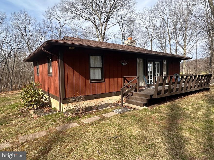 Beautiful home on almost 12 acres.  Very nice pasture views and a great yard.  Unrestricted land and great access for many roads, but off any main roads for peace and quiet.  Detached Garage with upper level storage.  2 bedrooms, one bath with a wood stove and large sunroom. Front and back decks of each side of the home.