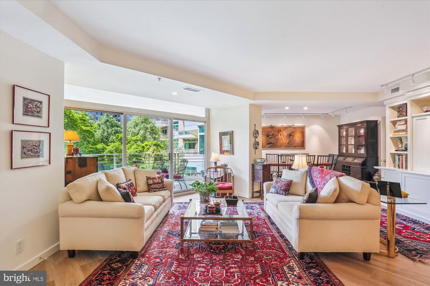 Welcome to this spectacular, light-filled 2,023 sq. ft. condo featuring a balcony with treed views! This residence has been beautifully renovated from top to bottom. It includes a welcoming foyer, an expansive living room with custom built-ins and sliders leading to the balcony, a formal dining room, and a family room/den also with custom built-ins and sliders to the balcony. This den can be converted back into the original second bedroom, which includes a full bath, as the plumbing is still in place. Additionally, there is an expanded  powder room and a private office equipped with built-in desk and cabinetry.

The gourmet kitchen boasts premium white shaker-style cabinetry, stone countertops, a ceramic tiled backsplash, and stainless steel appliances. It features a prep island, a breakfast area, and a laundry closet. 

The primary bedroom suite is a highlight, showcasing custom built-ins, a walk-in closet, and two double wall closets. The renovated spa-like bathroom offers an oversized shower, a dual sink vanity, a linen closet, and ample cabinet storage space. Throughout the condo, you will find custom shades and window treatments, beautiful wide plank flooring, and exquisite lighting and fixtures.

This sale includes two garage parking spaces (G2-200/201) and additional storage (G3-40).   Pets up to 25lbs are welcome!!

Experience elegant, resort-like living in the most luxurious complex and gated community in Friendship Heights, situated on over 17 acres. Amenities include a gatehouse, 24-hour valet service, concierge/front desk, 24-hour security, and a three-story clubhouse featuring heated indoor and outdoor pools, party rooms, a state-of-the-art fitness center, a racquetball court, billiards and ping pong rooms, an aerobics room, an art/hobby room, and tennis/pickleball courts. The grounds are lushly landscaped with walking paths for your enjoyment. 

Shops, dining, grocery stores, and the Friendship Heights Metro station are all just a leisurely stroll away.