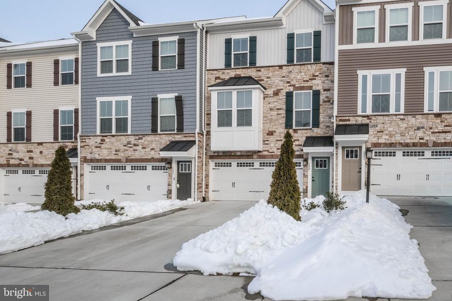 This is one of the best values in the Shenandoah Valley-located in a community surrounding a 117-acre lake with a huge private pool (with mountain views), community center and 24/7 fitness center (facilities just built in 2025-see photos)! TOTALLY MOVE-IN READY (with every inch immaculately cleaned), this extremely upgraded 2021 townhome shows like it’s BRAND NEW and is one of the larger homes in Lake Frederick with over 2,300 finished sq feet plus a 421 sq foot 2-car garage.Please be sure to READ THE CAPTIONS IN PHOTOS FOR EXTRA DETAILS and CLICK ON THE DOCUMENTS SECTION of the MLS listing for a plethora of BONUS INFO/SPECS. Where to begin–enjoy 9’ ceilings in the HUGE family room and dining room flanking the gourmet kitchen (with granite counters, 42” maple cabinets, island w/ 6-person bar seating, gas range and deep pantry). Rest well in the owner’s suite (tray ceilings, huge walk-in closet, luxury bath w/ soaking tub, walk-in tiled shower and double sinks), and work well in the bedroom-level oversized laundry room (w/ utility sink).The upper level also has 9’ ceilings, while the finished lower level features the 3rd ceramic tiled full bathroom and space for a 4th bedroom (or enjoy the 21x15 recreation room w/ sliding doors to the brushed concrete patio under the upper nearly maintenance-free 16 x 10 deck). Appreciate the nearby overflow parking spots, transferable warranties, $4k in custom blinds (child safe), high end Culligan water system, new flooring (rec room) in 2023, and house full of upgrades throughout! And it’s truly spotless (even clean behind washer/dryer)!

NATURE IS JUST A FEW HUNDRED YARDS AWAY via the 7+ acre Lake Frederick Wildlife Trail, which traverses the fish-filled lake and is accessed from the Bayhill Terrace cul-de-sac. Experience kayaking, canoeing, boating, fishing and hiking without driving!  An award-winning restaurant with a delightful coffee shop is 2 miles from the doorstep. Owners can also take advantage of the community playground minutes away and 4+ miles of dog-friendly paved walking trails along Rachel Carson Dr. The home is located merely 8 miles from I-66, I-81, Rt. 50 for easy commuting, 10 minutes from major retail shopping in Riverton, 10 miles from Costco and Winchester shopping, 20 minutes from both Winchester and Front Royal’s historic downtown areas,12 miles from the breathtaking Skyline Drive (Shenandoah National Park), 6 miles from Sherando Park and 8 miles from deep-water Shenandoah river access (great for jet skis and boats).NOTE that owners are automatically members of the Shenandoah Lodge, which grants access to host events in the fantastic venue (see brochure in documents section), and members of a friendly HOA that offers clubs/group events along with entertainment all year long. PRICED UNDER TAX ASSESSMENT, don’t miss your chance to snatch up this “bigger and better than new” home before the snow melts!