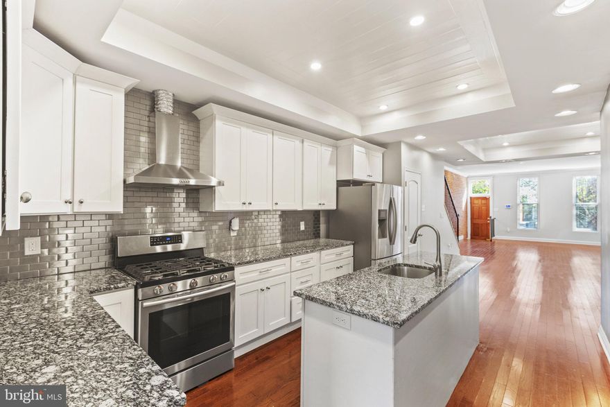 From the moment you walk in, the exposed brick, gleaming hardwood floors, and light-filled open layout set the stage for easy living and effortless entertaining. The kitchen is a showstopper—granite counters, stainless steel appliances, center island, and crisp white cabinets that feel straight out of a design magazine. And yes, the laundry is right on the main level (because life is easier that way). Upstairs, you’ll find roomy bedrooms and stylishly updated baths. Need more space? The finished lower level is the ultimate flex zone—guest suite, family room, or cozy movie nights by the sleek modern fireplace. Step outside your door and embrace walkable city life: Patterson Park(6 Min Walk)  neighborhood cafés ( JEMs), and local shops are just around the corner. Add in a brand-new roof, fresh paint, and thoughtful upgrades throughout, and this one is move-in ready from day one.