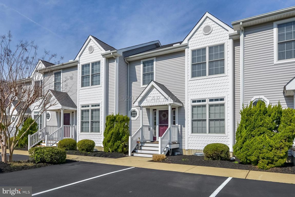 Live the good life in West OC, away from Hub-Bub yet convenient to marinas, shopping, great eats, beach resort. Pond, fountain, pool views. True Move-In ready, pampered 2nd home. Updated: carpet, full interior paint, crawl space encapsulated, lighting, added ceiling fans & TVS, full-sized washer & dryer, storm door, powder room window. Safety sprinklers, vaulted MBR w/ walk-in closet, jet tub, balcony. Great Rm gas firepl, hardwood flg, deck w/ locker, 2 assigned pkg. Pre-inspected + 1-yr Wty. CF @ $345/m, RE Taxes @ $157/m (no City tax). Cmty outdoor pool, center-quad pond, fishing & crabbing pier. Boat Slips as avl to purchase adjoining ''Seaside Village Marina''. Yr-rd rental potential @ $1,500/m + uty. Smaller congenial 42-condo Complex, min 90-day rental duration. No flood Insur req.