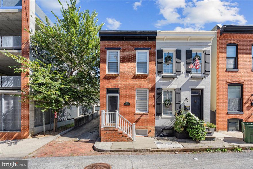 Charming 3BR/2BA end of group townhome located on a quiet side street in the heart of the Federal Hill Historic District. Make your way to the door into the living room featuring beautiful hardwood floors and a dining space with a brick fireplace.  The kitchen is in the rear with stainless steel appliances and tons of cabinetry and counterspace. Upstairs offers two large bedrooms, each with large closet space and a newly updated full bathroom. The rear bedroom features a privacy balcony, perfect for relaxing in the evenings. The lower level offers an additional bedroom and an updated full bathroom. The laundry room can also be found in the lower level equipped with a washer/dryer. A concrete patio completes the exterior, great for hosting family and friends. Imagine all this and located less than 2 blocks away from  numerous restaurants and bars and only a 10 to 15 minute walk to the Inner Harbor, Federal Hill Park and M&T Stadium!