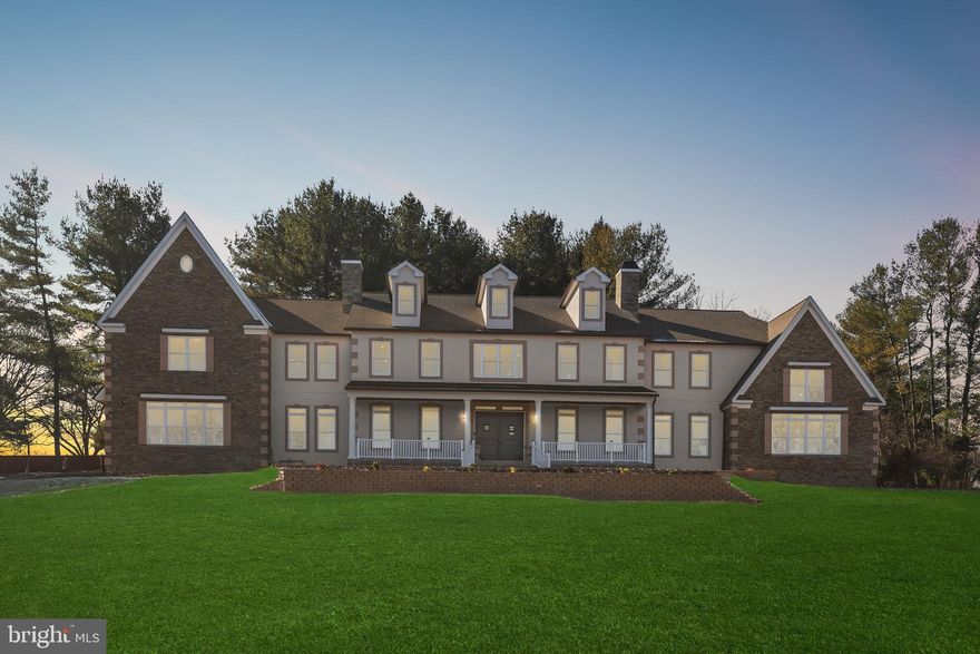 March Madness: The seller is offering a subsidy of 1% towards buyer’s closing costs with acceptable offer.
An extraordinary offering of scale, craftsmanship, and innovation, this newly constructed stone and stucco Colonial estate spans an impressive 12,702 square feet and is set on 2.86 acres within a private enclave. Designed for grand living and refined entertaining, the residence is surrounded by mature grounds that yield apples, plums, peaches, cherries, and blueberries each summer, an idyllic and rare natural amenity.  The home features 6 bedrooms, 7 baths, soaring two-story architectural elements, and a thoughtful blend of luxury finishes and smart-home technology throughout. Highlights include multiple entertaining spaces, a private office, a vaulted sunroom with stunning sunrises and sunsets, a winery, a sauna, and a fully equipped home theatre. LVP, tile, and porcelain flooring complement tray and vaulted ceilings, while surround sound, smart toilets, smart laundry, and four-zone climate control elevate everyday living. A stately 8-foot double-entry door with speak-easy styling opens to a dramatic double-height foyer with a grand staircase. The two-story dining room is a true showpiece, showcasing a tray ceiling crafted from reclaimed WWII-era lumber, antique wood planks meticulously milled, de-nailed, kiln-dried, and repurposed as a striking architectural statement. The adjacent two-story family room is anchored by a 51-inch color-changing porcelain-surround electric fireplace, framed by a wall of oversized picture windows, and a custom-crafted mantle.  The chef’s kitchen is designed to impress, featuring a top-of-the-line ZLINE bronze appliance package that includes a 48-inch dual-oven range with grill, pot filler, wall oven, microwave, dishwasher, and double sink. A dramatic 72-square-foot island comfortably accommodates banquet- or wedding-sized gatherings, while a coffee, tea, cocoa, and beverage bar, a butler’s pantry with wine cooler, and a fully organized pantry enhance functionality. The main level is completed by a living room, private office with French doors and a walk-in closet, a first-floor bedroom retreat with an ensuite bath, a mudroom with built-ins, and access to four individual garage bays.  The vaulted sunroom spans approximately 480 square feet, featuring a 15-foot ceiling with whitewashed wood planks, walls of windows, and French door access, an inviting retreat for year-round enjoyment.  Upstairs, the primary suite is a private sanctuary spanning approximately 1,872 square feet. It features tray and vaulted ceilings, a porcelain electric fireplace, a coffee and beverage bar, three closets, and a spa-inspired marble bath with dual showers, dual vanities, a soaking tub, a linen closet, and a smart toilet. Additional accommodations include an ensuite bedroom with a walk-in closet, a dual entry bath with a soaking tub, a smart laundry room with a GE washer and dryer, and overlook balconies to the foyer, dining room, and great room below.  The finished lower level is dedicated to lifestyle and entertainment, offering a full bar, home theatre, winery, bedroom, and a full bath with sauna. Mechanical systems are equally robust, including dual tankless water heaters, three HVAC systems, three AC units, an in-house sprinkler system, two sump pumps, and a dedicated electrical and mechanical room.  Additional exterior and functional highlights include a 376-square-foot columned front porch, wraparound patio and walkways, a four-car garage with ceiling openers and keypads, two EV charging ports, parking for approximately 15 vehicles, well and natural gas utilities, and an expansive private setting that balances luxury with tranquility.  This one-of-a-kind estate delivers uncompromising quality, exceptional scale, and timeless elegance, crafted for those who seek a truly distinguished residence.  Major commuter routes include MD-32, MD-29, US-40, I-70, and I-95.