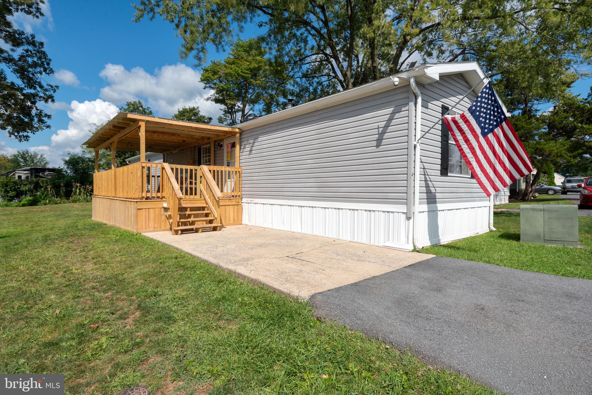 Nestled in the charming Oak Knoll Estates, this delightful 2-bedroom, 2-bathroom manufactured home offers a perfect blend of comfort and convenience. Built in 2006, this single-wide Redman model spans 924 sq. ft., featuring a well-designed layout that maximizes space and functionality. The heart of the home boasts a cozy kitchen featuring a farmhouse sink, a gas oven/range, a refrigerator and butcher block countertops with an option for peninsula seating. Enjoy the ease of laundry days with an ENERGY STAR washer with bluetooth & detergent dispenser & electric dryer. The property also includes a handy shed for extra storage. With parking available on the driveway and street, accessibility is a breeze. Residents of this community can take advantage of nearby parks, shopping, and dining options, fostering a sense of connection and belonging. Experience the warmth of Oak Knoll Estates, where comfort meets convenience in a welcoming neighborhood. All buyers must be park approved by PMI.
