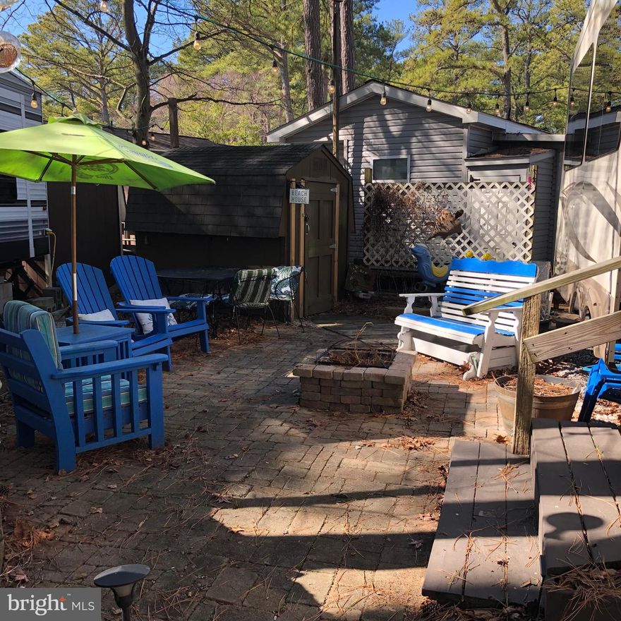 Wonderful LOT  now available at Beach Harbor Camper's Co Op which is a Private, Gated Membership  on the Chester River!  Unique camping in the woods and on the shore. 6 Miles East of the Chesapeake Bay Bridge.      3 Season Campground Open Mid March to Mid November    263 Lots, water and sewer hook-up.      This lot has a great paver patio, shed with full size refrig,  patio furniture included and golf cart!      Currently on lot is a 2015 Silver Back by Cedar Creek which  is available to purchase from the Sellers.   For $15,000 -       Wonderful amenities include 2 launch ramps, playground, outdoor pool, 2 pavilions, boat yard  ( is currently wait listed)  TENNIS, Hot Tub,  beach, shuffleboard, basketball hoops and so much more!  settlement takes place at the office at Beach Harbor ($500 fee)  Motivated Sellers!   Come take a look! You will be impressed!