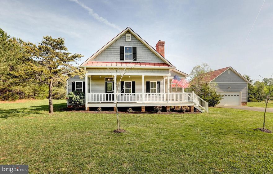 Welcome to your dream retreat at beautiful Lake Anna! This charming home includes a deeded boat slip (E3) in the common area and is located in the most desirable subdivision on the private side of the lake: The Waters at Lake Anna. With fantastic amenities like a community pool, clubhouse, tennis and pickleball courts, a sandy beach, boat ramp, and more, this neighborhood offers the ultimate lake lifestyle. High-speed fiber internet available! This classic home—built by Southern Image Design Builders—was designed to stand the test of time. Step inside to find 2,639 square feet of inviting living space, featuring 4 bedrooms, 3 full bathrooms, and an open-concept layout. Enjoy wide-plank hardwood floors on the main level, a cozy gas fireplace, and a spacious kitchen with a center island, granite and corian countertops—perfect for entertaining. The main level primary suite features a jetted tub, double vanity, and a walk-in shower. You’ll also find a second bedroom, a full bath, and a laundry room on the main level—all with 36-inch-wide doorways for accessibility. Upstairs, your family and guests will love the two additional bedrooms (one exceptionally large) and full bath. Outside, relax on your wraparound covered porch, unwind in the screened-in back porch, or host summer BBQs on the large brick patio. A breezeway connects you to the 24x28 garage with 13-foot ceilings—perfect for storing your boat, vehicles or lake toys. Plus, the metal roof and paved driveway add the perfect touch! HVAC system replaced in 2021. Excellent location: just 5-10 minute drive to groceries, restaurants, ABC, nail salon, vet clinic, Lake Anna Taphouse, coffee, The Yacht Club and more!