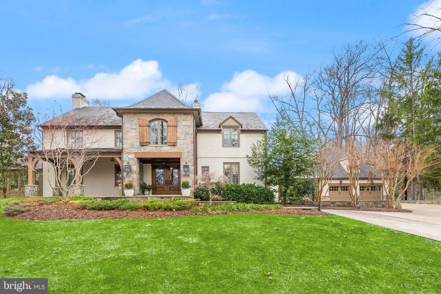 Nestled on over an acre of lush greenery, 8820 Burning Tree Road in Bethesda, Maryland, is an expansive 6-bedroom home designed for comfortable and luxurious living. This remarkable property offers wonderful indoor and outdoor living spaces, featuring an expansive flagstone patio that leads to a large, beautifully landscaped yard, perfect for entertaining or relaxation. Inside, the home boasts an open-concept kitchen and family room, ideal for casual gatherings, alongside formal living and dining rooms for more refined occasions. A private office and a charming sunroom add to the versatility of the main level.

Upstairs, the spacious primary suite provides a serene retreat, accompanied by three additional bedrooms, a second office or nursery, and three additional bathrooms. The basement offers a recreation room, perfect for family activities or entertaining guests and full bathroom. Completing this outstanding property is a separate two-car garage, with a guest suite above, providing a private and comfortable space for visitors complete with its own kitchenette. This home embodies elegance, functionality, and privacy, all within a sought-after Bethesda location.