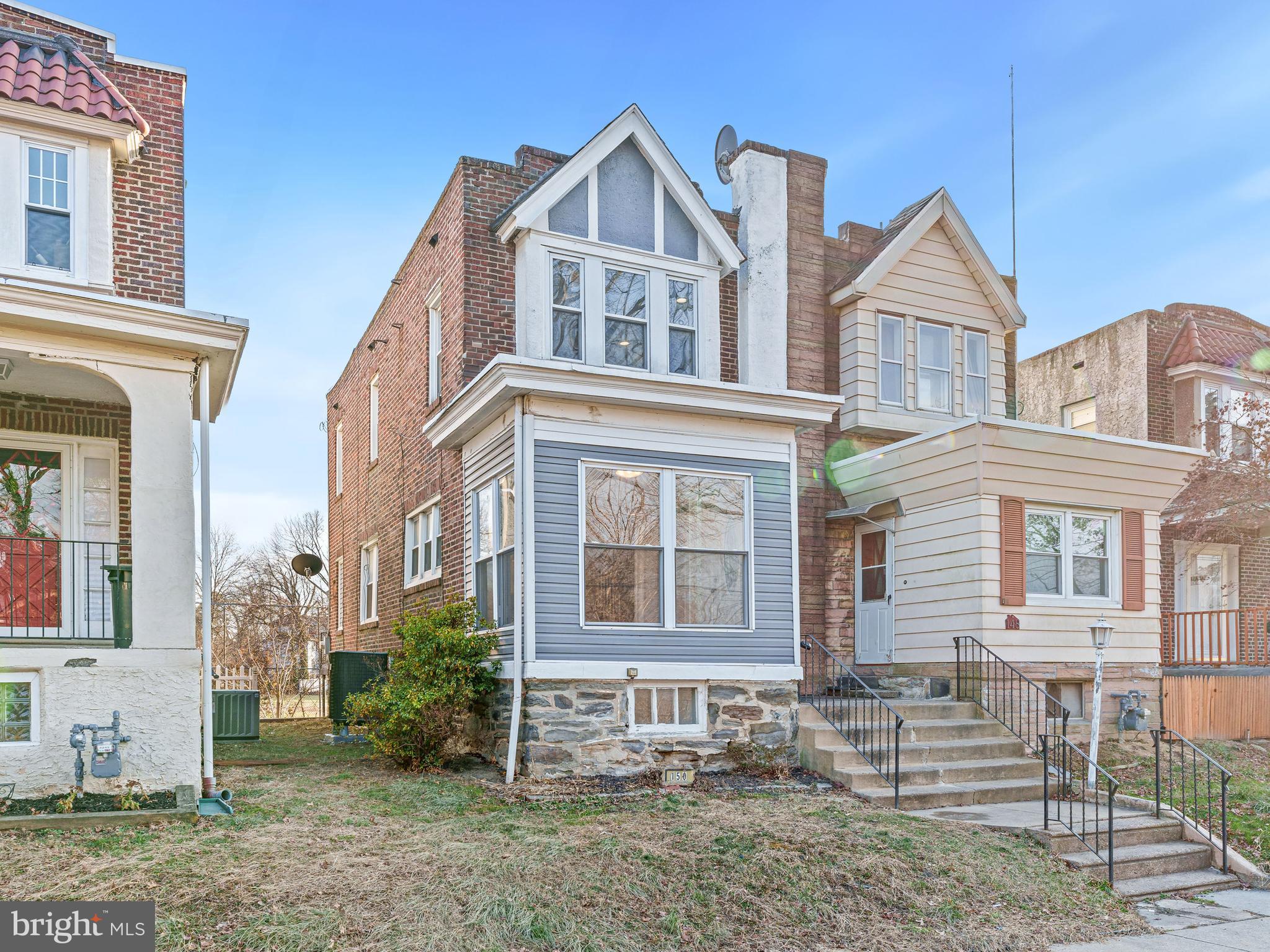Welcome to 150 Woodland Ave, the only twin on the market in Lansdowne with central air and finished basement! Enter through the enclosed porch into a spacious living room featuring recessed lighting and hardwood floors, which continues into the dining room and kitchen. The newly renovated kitchen boasts quartz countertops, brand-new stainless steel appliances—including a refrigerator, stove, dishwasher, and microwave—and access to a back patio, perfect for outdoor entertaining. A convenient half bathroom completes the main floor. Upstairs, you’ll find 3 bedrooms with hardwood floors and a full bathroom. The finished basement, with outside egress, offers space for a 4th bedroom as well as an attached 1-car garage and laundry hookups. With updated mechanicals, electric, exterior siding, new HVAC and hot water heater, plus two off-street parking spots, and a prime location near parks, schools, and transit, this home is a must-see. Schedule your showing today!
