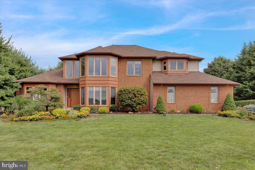 Welcome to 1230 Church Lane Road – a stunning, custom-built 5-bedroom, 3.5-bath home that blends unique architecture with warmth and functionality. From the moment you step inside, you're greeted by soaring ceilings, natural wood tones, and beautiful hardwood floors illuminated by dual chandeliers. To your right, a bright office/study with large windows and French doors provides a quiet retreat for work or relaxation.  On your left, the great room invites you in with its stunning hardwood floors and impressive, sky-high ceilings, creating a space both grand and inviting. The kitchen is a chef’s delight, featuring custom tiled flooring, Corian countertops, natural wood cabinetry, recessed lighting, and a third elegant chandelier. A breakfast nook with a built-in desk seamlessly opens into the inviting family room, where a gas-powered brick fireplace creates a cozy focal point. The raised-ceiling dining room, accessible from the kitchen, offers the perfect setting for gatherings. A convenient first-floor laundry/mudroom and half bath complete the main level. Designed for everyday living, the home boasts a large exterior deck, accessible from the kitchen’s sliding glass doors. Adjacent to the family room, a charming three-season sunroom offers a peaceful escape—ideal for plants or quiet moments. Large windows throughout flood the home with natural light, while dimmable lighting lets you set the perfect mood. The oversized two-car garage includes extra storage and connects into the laundry/mudroom for convenience. Ascending the winding staircase, the second floor offers four spacious bedrooms and two full baths. The luxurious master suite is the centerpiece, boasting an expansive bedroom, two walk-in closets, and a spa-like private bathroom with custom tile, dual vanities, a walk-in shower, and a jacuzzi tub. The finished daylight basement adds even more versatility, featuring an additional bedroom, full bath, and an open carpeted/tiled area—perfect as a playroom, entertainment space, or home gym—along with ample storage. This home is designed for family living, with large front and back yards, a spacious driveway, and a natural pine tree border for privacy. The open-concept layout fosters connection, while the upper-level bedrooms offer peace and seclusion. Ideally located in the highly sought-after Exeter Township School District, this home sits atop scenic Church Lane Road, directly across from a breathtaking 46-acre nature sanctuary. Enjoy the perfect balance of privacy and convenience—just minutes from major routes (422 & 222), shopping, and dining. Don’t miss the opportunity to make this one-of-a-kind home yours!