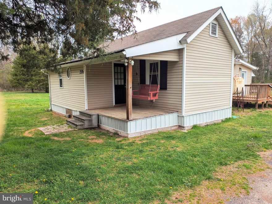 5 ACRES!!! If you are looking for a peaceful get-a-way and /or a full-time home, then this is a must to see. This cute Bungalow needs a little work. The house is approximately 1,116 sq. ft. with oil free-standing heaters. The building in the back would make a fantastic "Man Cave or Women Cave". or possibly a guest cottage.   The home conveys with 2 bedrooms and 2 baths. Also, additional sheds with plenty of storage. Most of the 5 acres is flat and open. It has its own well and septic system. This property is being sold in "as is condition in all respects."