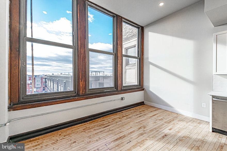 *Available NOW!*

Don't miss this breathtaking studio, 1 bathroom with unobstructed views of the Philadelphia skyline! This unit has everything: hardwood floors, mini split system heating/cooling, recessed lighting, washer/dryer in unit and massive windows! The kitchen has white cabinets with sleek hardware against textured white subway tile backsplash, quartz countertop, a garbage disposal and stainless steel dishwasher, microwave, refrigerator and electric range. The bathroom features a vanity with the same countertop that matches the kitchen and shower/tub with a sliding glass door.

The Walter George Smith Public School, listed on the National Register of Historic Places, has undergone an amazing transformation to bring you these brand new luxury apartments! Each unit features high end finishes while preserving it's historic character such as the chalkboards, original trim and closets, and overall unique floor plan. All tenants will have access to the three outdoor spaces (over half an acre combined!) on ground floor and mezzanine patios, and roof deck with stellar skyline views! Located at 19th and Wharton in Point Breeze, you'll be minutes from the American Sardine Bar, Graduate Hospital, East Passyunk and MORE!

Lease Terms: Generally, 1st month and 1-month security deposit are due at, or prior to, lease signing. Landlord may require other terms such as last month's rent upfront—$ 65 application fee per applicant. Tenants are responsible for: electricity, gas (if applicable), cable/internet, and a $10/mo technology fee. Water is a flat monthly fee of $60. Additional fees or requirements may be applicable for units with Homeowners or Condo Associations.  Landlord Requirements: Applicants to make 3x the monthly rent in verifiable gross income, credit history to be considered, have no evictions within the past 5 years, and must have a verifiable rental history with on-time rental payments. Exceptions to these criteria may exist under the law and will be considered. Cosigners will be considered.

*Price reflects the net effective rent after a 2-month credit is applied to a 14-month lease at $1,195/mo.
*Sorry, no cats
*1 dog <45 lbs permitted with owner approval + $50/mo pet fee
*Photos of a similar unit
*UTILITIES: Residents Responsible for Electric Usage & Flat Monthly Water/AC/Heat fee of $100