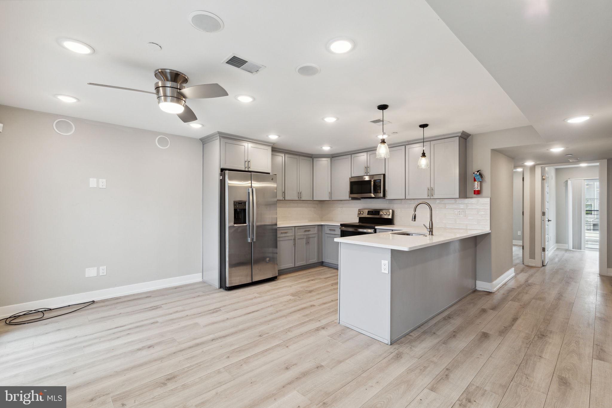 Welcome to 2408 N Masher St, Unit 2! This stunning 2 bedroom, 1 bathroom apartment boasts both style and comfort. Upon entering, you'll immediately be drawn to the large windows that flood the living area with natural light. The living and dining area features surround sound, perfect for a movie night in or entertaining guests. The kitchen is equipped with sleek blue/gray cabinets and stainless steel appliances, including a dishwasher for easy cleanup. The breakfast bar is a great spot for a quick bite or enjoying your morning coffee. The first bedroom features surround sound and a walk-in closet, while both bedrooms have Juliet balconies to enjoy the fresh air. The bathroom has a full-length shower and with nickel finishes. Convenience is key with in-unit laundry, making laundry day a breeze. This unit is perfect for anyone looking for a comfortable and stylish living space. Don't miss out on the opportunity to call 2408 N Masher St, Unit 2 your home! $75 monthly water fee will cover all cold water usage. The York-Dauphin Station for the Market Frankford Line is just a few blocks away creating easy access to Center City, and just around the corner from the amazing restaurants Philadelphia has to offer! First, last, and security deposit required to move-in.