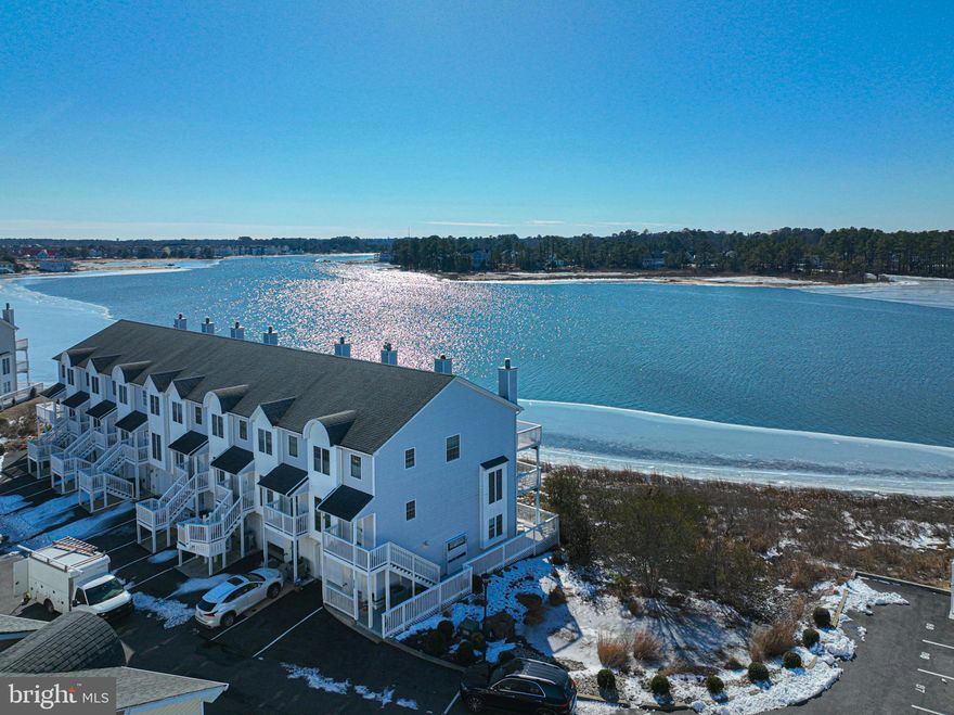 If you’ve been dreaming of a waterfront home with serene views and your own deeded boat slip, this turn‑key property delivers. This 3‑bedroom, 3.5‑bath, one-car garage home spans three levels designed for easy coastal living and a relaxed beach vibe. Just a short distance to downtown Bethany Beach, James Farm Ecological Preserve, Fresh Water State Park, Bethany Tennis Club, shopping, and local eateries. 
 The first floor features a bedroom, full bath, and a wrap‑around deck offering private water views.
The light‑filled second floor showcases a beautifully remodeled kitchen designed to maximize the stunning water backdrop. An oversized island, dining area, family room with wood‑burning fireplace, and a convenient half bath create an ideal space for gathering and entertaining. Step outside to the second‑floor deck—perfect for outdoor meals and unforgettable sunsets.
The third floor includes a spacious ensuite guest bedroom, hall laundry, and a generous primary suite with three closets, an ensuite bath, and its own sun‑drenched private deck. It’s an inviting spot to start the day or soak up a little afternoon sun.  
Offered fully furnished and move‑in ready, this home makes waterfront living effortless. Your waterfront lifestyle awaits.