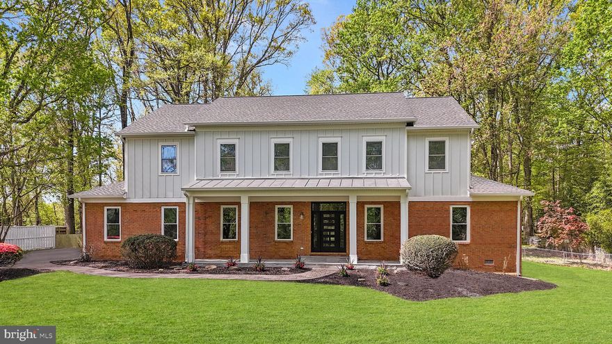 ***Catered Open House on Saturday May 24th 1-3pm and Sunday May 25th 1-3pm***
Step onto the wide flagstone porch, listen to the breeze in the oaks, and feel the surprise of discovering a home that was essentially rebuilt from the studs up. Fresh James Hardie concrete siding and Azek trim mean you won’t be out on a ladder repainting every few seasons. A standing-seam metal roof shelters the porch, while impact-rated architectural shingles and oversized gutters guard the rest of the structure. Behind the carriage-style doors, the two-car garage hides a level-two EV charger and direct entries to both the mudroom drop zone and the butler pantry—so bags and groceries never touch bad weather.

Inside, nine-foot ceilings on both the main and upper levels create instant volume. A custom extra-wide staircase with simple modern railing anchors the open plan and shows off the engineered distressed white oak luxury vinyl flooring that flows throughout the home. Four-inch recessed lighting runs wall to wall, and in the evening, the dining room’s show-stopping crystal chandelier and the family room’s statement fan take over. New 400-amp electrical service, dual high-efficiency Carrier heat pumps, a whole-house well filtration system, and a supersized water heater quietly handle the heavy lifting behind the scenes.

The kitchen feels equal parts designer studio and smart lab. Samsung Bespoke AI appliances learn your patterns, quartz counters wrap every work surface, and a porcelain backsplash pulls it all together discreetly under cabinet lighting. Around the corner, a true walk-in butler pantry offers its own sink, prep space, refrigerator hook-up, and floor-to-ceiling custom shelving so party supplies stay hidden until showtime. Just beyond the pantry, a private office with its own exterior entrance is ideal for client meetings—separate from your living space for uninterrupted privacy. Nearby, a main floor bedroom suite with its own laundry and full bath offers multigenerational ease. An additional powder room is on the main level for all the guests. 

Upstairs, two secondary bedrooms each enjoy a private bath, while a common-area coffee and beverage bar turns the landing into a cozy lounge. The primary retreat stretches across the rear, opening through glass doors to a covered balcony that overlooks your gorgeous flat 1 acre lot! The luxurious primary bathroom includes twin rain heads and handhelds flanking a freestanding soaking tub, back-lit anti-fog mirrors, motion-sensing lights for late-night ease, and a hidden television hookup so you can catch the game from the tub. Dual walk-in closets give each partner real breathing room, and the connected laundry room to the master bedroom makes your life so much easier. 

The finished lower level adds a full bath, a flex room wired for theater sound or gym gear, and still leaves plenty of space for storage. Outside, a flagstone grilling patio sits just below the balcony, opening to a deep, private yard on a full acre that feels like your own park. A long driveway provides privacy from the road and offers ample space for guest parking—perfect for hosting friends and family.

Every drain pipe, distribution box, meter base, and disconnect is new. So are the smart touchless bidet commodes, the two laundry rooms, the wet bar, the recessed lighting in the covered second-floor balcony ceiling, and the maintenance-free exterior trim. All you have to do is move in, pour a drink on the porch, and decide which room of this thoughtfully rebuilt home is going to be your favorite tomorrow.