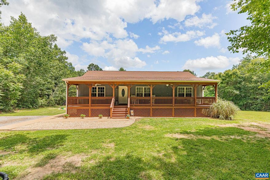 Welcome to 3364 Mt Airy Rd, Louisa, VA!  Discover this gorgeous 3-bedroom, 2-bath rancher, perfectly nestled on 3.31 private acres. This beautifully maintained home offers an inviting open floor plan with the primary suite thoughtfully situated on one side and the guest bedrooms on the other?ideal for privacy and comfort.The spacious living room features a stunning stone fireplace, vaulted ceilings, and gleaming hardwood floors, creating a warm and welcoming atmosphere. The kitchen offers ample cabinet and storage space, flowing seamlessly into a charming breakfast/sunroom that overlooks the serene backyard?perfect for enjoying your morning coffee while listening to the birds sing. Step outside and relax on the peaceful country front porch or the oversized rear deck, surrounded by nature. Located just minutes from the town of Louisa and within an easy commute to Richmond, Charlottesville, or Fredericksburg, this home offers both tranquility and convenience. Pride of ownership shines throughout?don?t miss your chance to make this slice of country paradise your own!,Oak Cabinets,Fireplace in Living Room