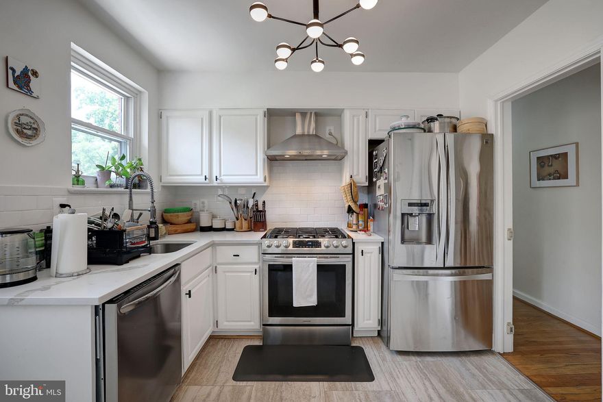 Welcome to this creative's dream home, where thoughtful design meets comfort and convenience. Step into the sun room and into a sun-filled living room featuring a functioning fireplace, overlooking a formal dining room and kitchen. The kitchen boasts new stainless steel appliances and opens onto a deck extending to a spacious backyard—perfect for barbecues or enjoying sunny summer days. A strategically located powder room ensures convenience for guests during dinner parties. Down the adjacent hallway, discover a full bathroom and three well-proportioned bedrooms, all designed for easy access. The hallway also leads to the basement, where an expansive living area awaits with a second functioning fireplace, ideal for entertaining or as a versatile play space. Recently renovated, the basement includes an additional full bathroom and an extra room for use as a bedroom, office, or storage. Amenities include a washer and dryer conveniently located in the basement. A front-facing garage accommodates one car, complemented by driveway parking for another vehicle. The roof has been recently replaced, ensuring peace of mind and added value. Situated near shops and businesses, this home offers easy access to daily necessities. Metro accessibility and proximity to highways provide effortless commuting options, with quick access to downtown DC and beyond. Just 2 miles from Downtown Silver Spring metro station, enjoy access to the Red Line and a vibrant mix of shops, dining, and entertainment. High school students benefit from a choice of school districts—from Silver Spring to the Bethesda Chevy Chase school cluster—due to the convenient location. Don't miss the opportunity to make this meticulously maintained and upgraded home yours!