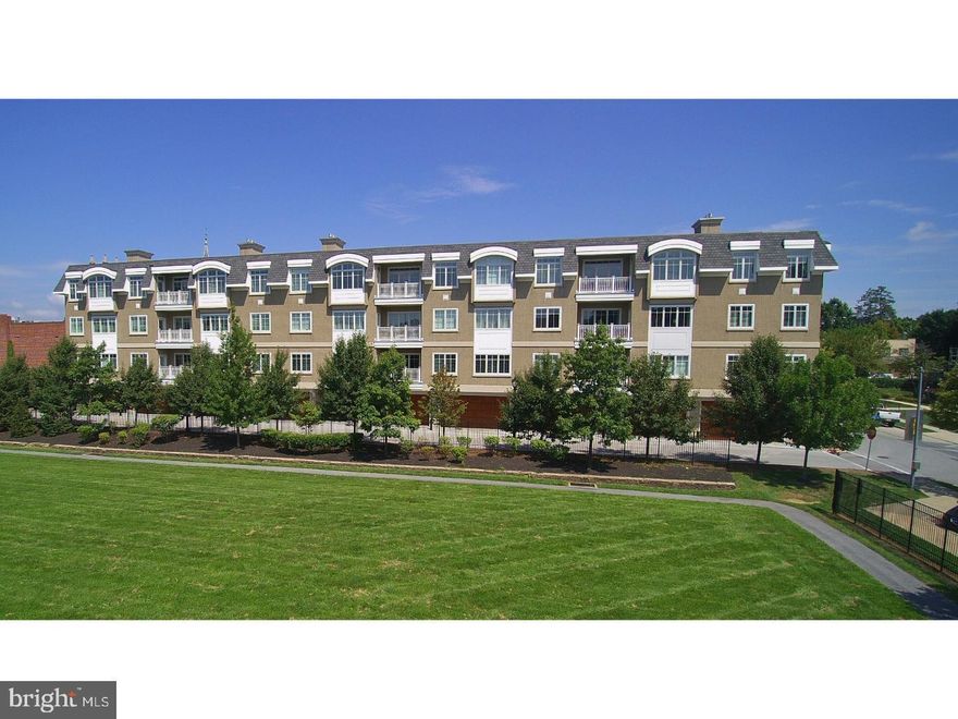 Welcome to 102 Louella Ave! One of the most sought after condominium developments in the heart of Wayne. This exquisite penthouse unit is truly the premier unit in the building.  As you enter the lobby of the building you are greeted with beautiful decorating and elevator to take you to the top floor to unit C3.  The solid wood entry door opens to a lovely foyer with wood wainscoting, a large walk-in hall closet, bedroom that could be used as study with door to balcony and full bath all with 10' ceilings  and hardwood flooring throughout the unit. Turn the corner to an expansive open floor plan including kitchen with under cabinet lighting, top of the line appliances, sub zero refrigerator, upgraded quartz countertops and large island and laundry room off the kitchen with built in cabinets and shelving. Then there is the dining room with spectacular chandelier,  bar area with cabinetry, granite counter top and under cabinet lighting and large inviting living room with built-ins and gas fireplace for family and friend entertaining.   Complementing this wonderful living space are the walls of windows with plantation shutters and a door to balcony overlooking the grassy fields below. The next stop is the 2nd bedroom with a full marble bath and walk in closet. Finally to the owner's suite which is light filled with 2 walls of windows, plantation shutters ceiling fan and views that go on forever. The expansive dressing room has custom closets organizers and windows and is anyone's dream. Luxurious owners bath with marble flooring, soaking tub, frameless glass shower, private water closet and plantation shutters makes preparing for the day a relaxing experience. Bonus features of this unit are a large locked storage unit on the first floor and a two car garage with garage door opener with inside entrance to the lobby and ideally situated near the elevator. Lastly the 2nd lobby off of Louella with a grand staircase is available if you choose the steps instead of elevator. This unit offers everything that one could want and with the convenience of walking to heart of Wayne to enjoy the restaurants, shops, train and neighbors.