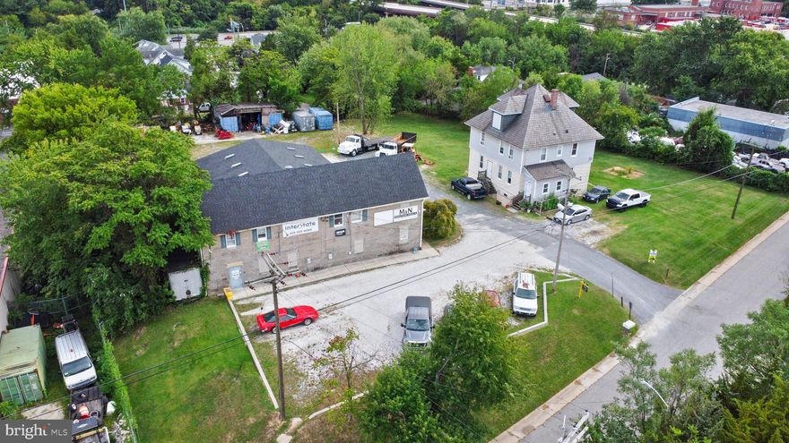 Two adjacent I-L parcels totaling 1.+- acres. 6917 Proctman is .68 acres and is currently used as a construction yard and office. 6915 Proctman is .344 acres and has a large house on a cleared lot. An undeveloped paper road, Scheeler Ave, appears to bisect the properties on the land records. The Seller is conducting due diligence to confirm the road is privately owned. Access to I-95, I-895, and Route 40 is less than a mile.  Assessment , tax info for  6917 only  Owner is Md  licencee