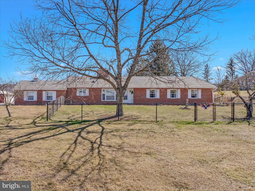 Welcome home to this beautifully preserved and thoughtfully updated 1964 brick rancher — where vintage charm meets modern comfort in all the right ways.

Set on 2.00 unrestricted acres with panoramic mountain views, this property is truly something special. From the moment you arrive, you’ll feel the warmth and care that has gone into maintaining the integrity of its classic style while adding meaningful upgrades throughout.

Outside, the land invites you to slow down and breathe it all in. Enjoy a lush fenced garden area, fenced front yard, established flower beds, fruit trees, Elliot pecans, and a butternut tree — plus native pollinator plantings that bring the landscape to life. There’s even an electric-fenced garden plot and underground dog fence for added convenience. Whether you're dreaming of homesteading, gardening, or simply soaking in the views, this property is ready.

Outbuildings and exterior features include:

Detached 16x24 garage/workshop with electric — perfect for projects or extra storage

20x21 carport with electric

Attached garage with updated doors and trim for easy access during inclement weather

Welcoming front yard and rear patio — ideal for enjoying sunrises and those breathtaking mountain sunsets

Step inside and you’ll find a complete refresh with all new paint throughout. The kitchen, positioned to capture a stunning sunset view, has been beautifully updated with newer appliances, including a European convection oven, dishwasher, stovetop, updated hardware, and refreshed flooring. It flows seamlessly into the breakfast area/den featuring a cozy gas fireplace and picture-worthy western views.

The living and dining rooms are filled with cheerful morning light and easterly views of Sleepy Creek Mountain. The foyer greets you with charming retro tile and generous space for coats and daily essentials — a nod to the home’s authentic mid-century roots.

Down the hall are four spacious bedrooms, each offering excellent closet space and mountain views. The main bath retains its retro tile charm while benefiting from updated faucets, fixtures, and toilet. The primary suite offers its own updated bath with a refreshed shower, flooring, and fixtures — blending vintage character with modern touches.

The basement provides two large, open, fully improved spaces with painted floors and sealed walls — ideal for collectors, crafters, hobbyists, or your next hangout retreat.

Major updates and improvements include:

HVAC and ductwork

New well pump, casing, lines, and filters

Gas logs

Storm doors

Gutters and downspouts

Ceiling fans and light fixtures

Roof (2018)

Updated tilt windows

Oil furnace serviced Fall 2025

A full list of updates will be available in the online documents.

Located just 10 minutes from downtown Berkeley Springs — known for its charming spas, antique shops, local dining, and entertainment — and a short drive to Cacapon Resort State Park and nearby rivers for outdoor adventure, this property offers the perfect blend of privacy and convenience.

This is more than a home — it’s a lifestyle. Live off the land, savor the sunsets, and fall in love with a property that truly stands apart.