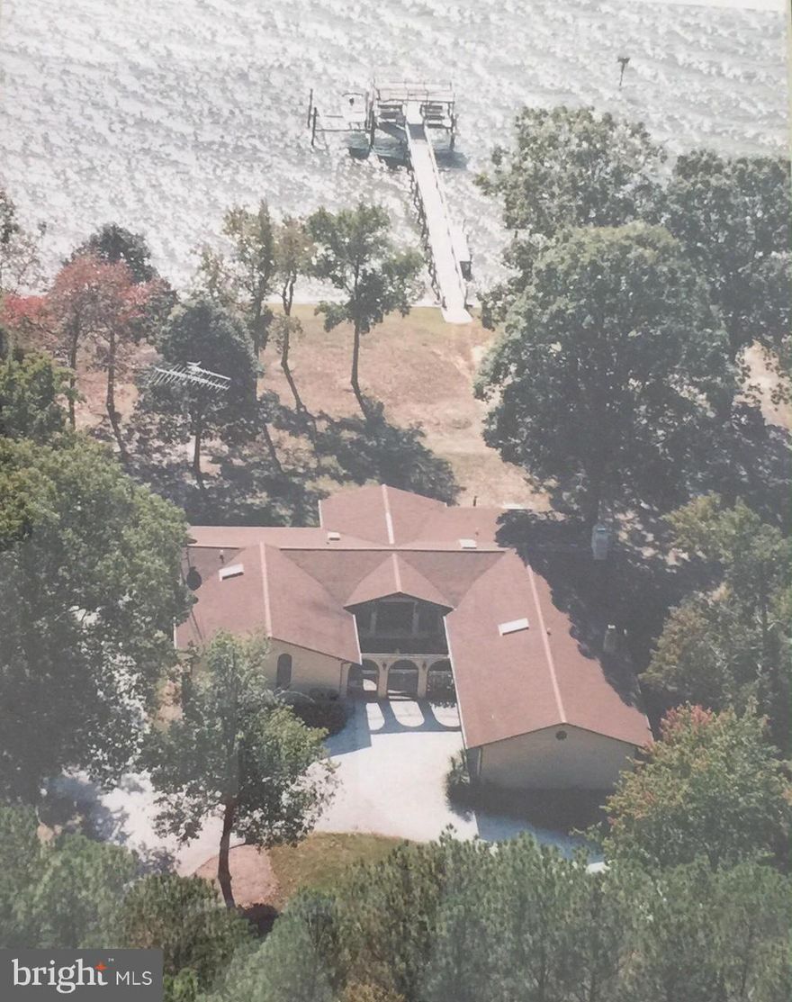 Fabulous View of the Potomac River!  Sold As Is.  Beautiful large wood beams through house.  Skylights and lots of windows bring the light into this lovely home.  Has 5' wide pier.  Covered patio in back.  Wood burning wood stove in family room.