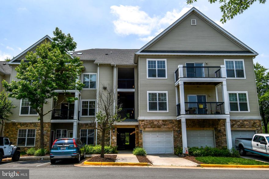 Bright two bedrooms condo in gated community with the following features:  hardwood floor living and dining area, gas cooking, computer/office nook, walk-in closet, fireplace in living room, full size washer and dryer, balcony, and so much more! Community features: pool, business center, fitness center, playground, clubhouse. Commuters will appreciate the proximity to major highways and public transportation, facilitating seamless travel throughout the region. ​Don't miss the opportunity to make this your new home.