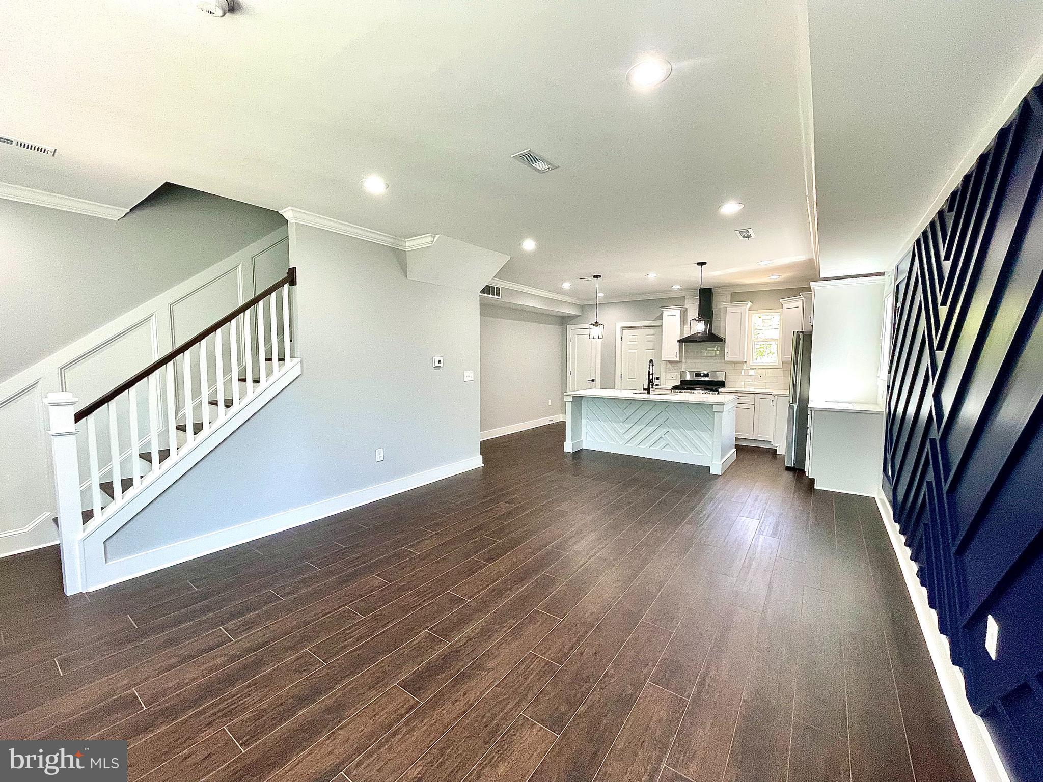 Welcome to this stunning, fully remodeled semi-detached rowhome offering over 2,200+ square feet of thoughtfully designed living space across three spacious levels—all for under $400,000. From top to bottom, this home has been transformed with modern finishes while preserving its classic charm, creating a perfect blend of comfort, style, and value.
As you enter, you're greeted by an open-concept main level featuring expansive living and dining areas filled with natural light, complemented by an eye-catching navy blue accent wall with luxury vinyl flooring and a seamless flow that's perfect for both entertaining and everyday living. The brand new kitchen is the heart of the home, complete with quartz countertops, soft-close cabinetry, stainless steel appliances, and a large island that invites gathering.
Upstairs, the private living quarters include a spacious primary suite with a beautifully updated ensuite primary bathroom w/ the option to add a soaker tub inside (left in bedroom for size reference), along with two additional bedrooms and a stylish full bath.
The fully finished basement offers incredible flexibility with a large open area perfect for a family room, home office, or guest suite, plus a full bathroom and laundry area.
Enjoy outdoor living with a private gated backyard ideal for relaxing or hosting, along with the convenience of off-street parking. With brand-new systems throughout and high-end finishes at every turn, this home is truly move-in ready.
This is a rare opportunity to own a fully renovated, spacious home at an unbeatable price. Schedule your showing today and experience everything this incredible property has to offer.