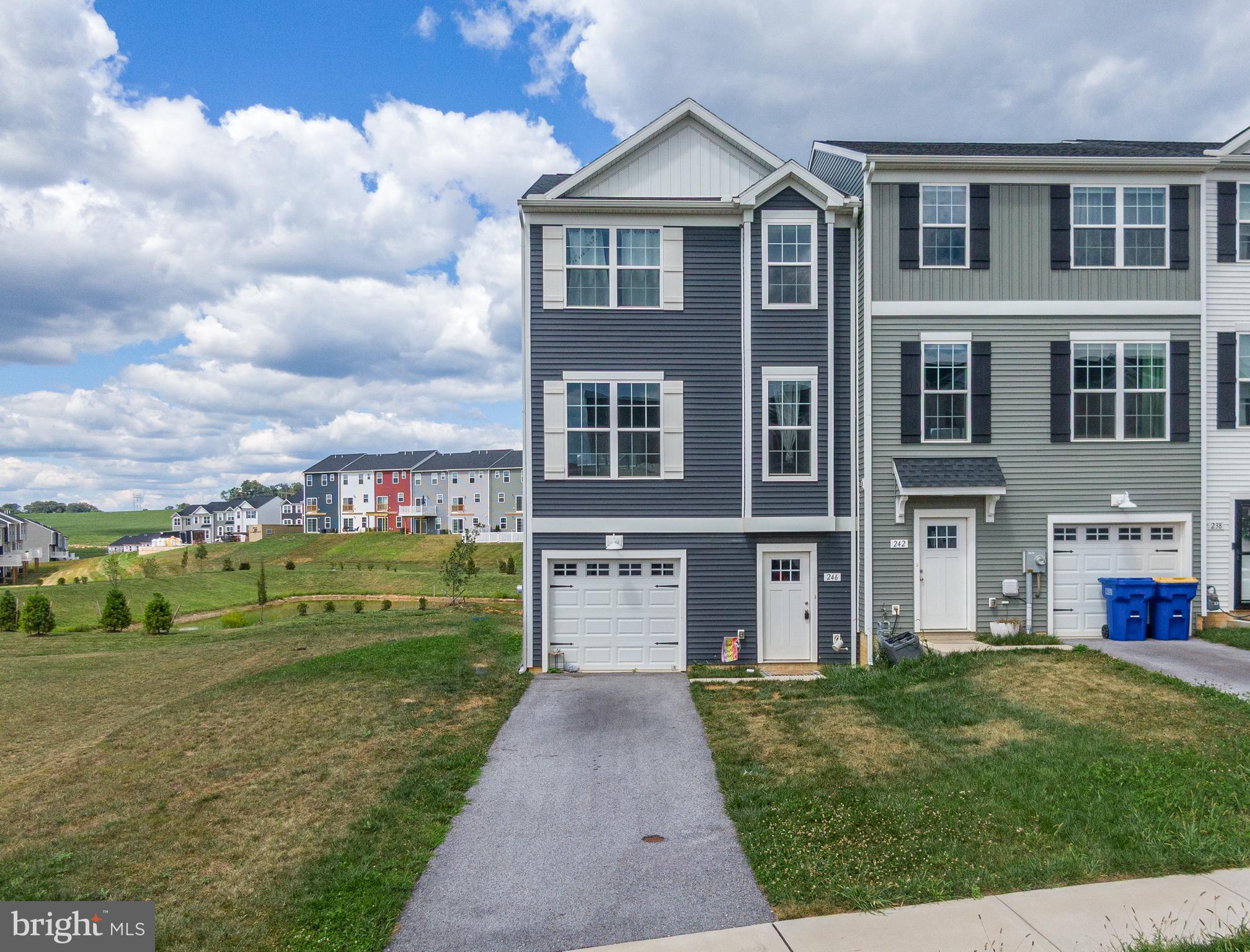 MOVE-IN READY LUXURY TOWNHOME IN HUDSON RIDGE! Welcome to this stunning 3-bedroom, 2.5-bath end-unit townhome, perfectly situated in the sought-after Hudson Ridge community. Skip the wait—this home is ready for immediate occupancy.
Step inside to discover a spacious entry-level recreation room and half bath, ideal for a home office, gym, or entertainment space. The main living floor boasts an open-concept kitchen and dining area, featuring granite countertops, a large island, stainless steel appliances, gas cooking, and upgraded lighting and hardware—perfect for hosting and everyday living.
Upstairs, the luxurious primary suite offers a cathedral ceiling, a generous walk-in closet, and a private bath with granite finishes. Two additional bedrooms with ample closet space, a full hallway bath, and a convenient laundry area complete the upper level.
Enjoy the peaceful, country-like setting while being just minutes from grocery stores, restaurants, and major conveniences. With numerous upgrades throughout, this home is a must-see. Come make Hudson Ridge your new home!