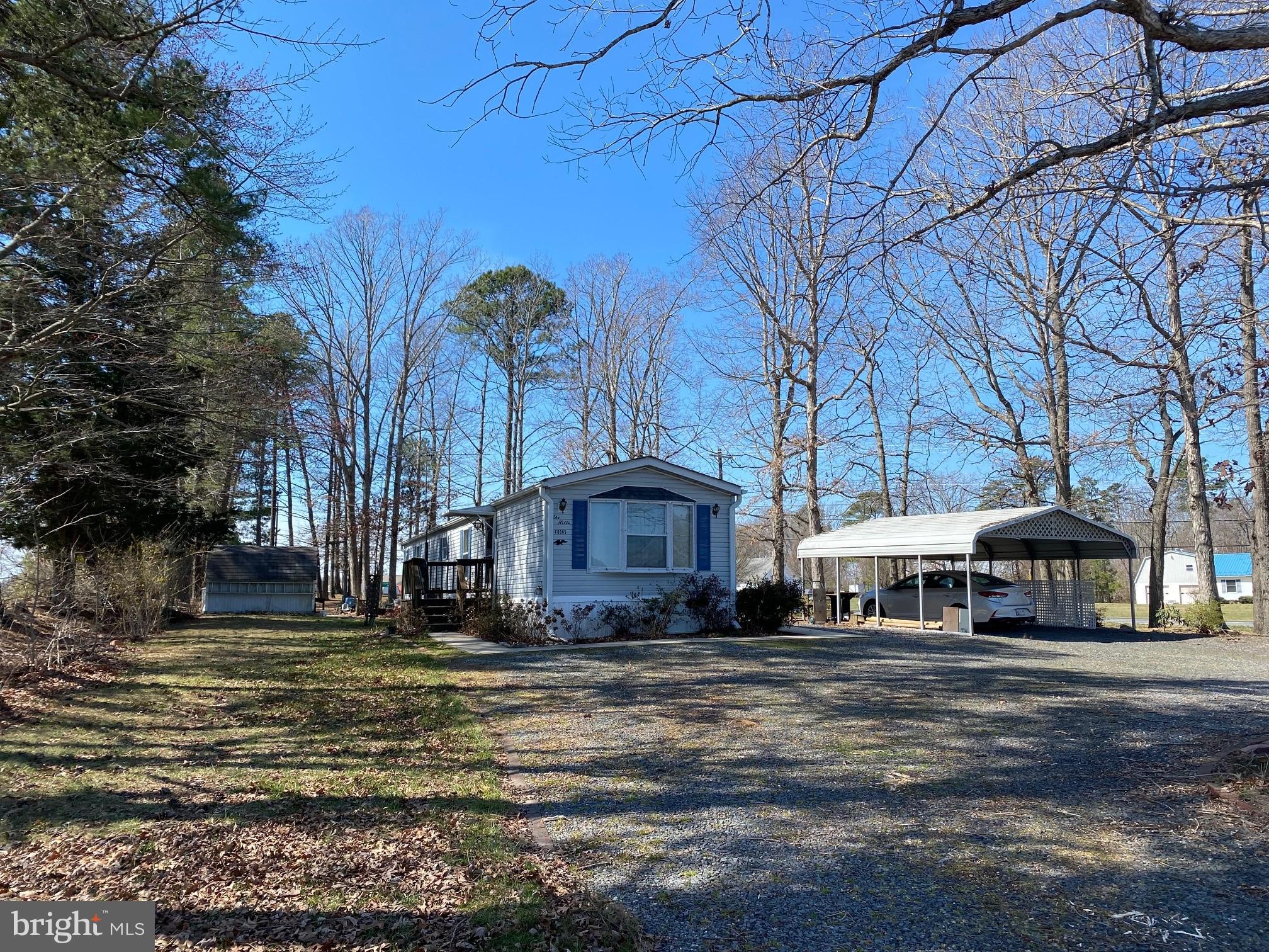 Mobile home on corner lot. Tax info has 1965 but mobile home was repalced with a 1992. Oil furnace, CAC. Some furniture can convey. Carport & 2 sheds. Deck.