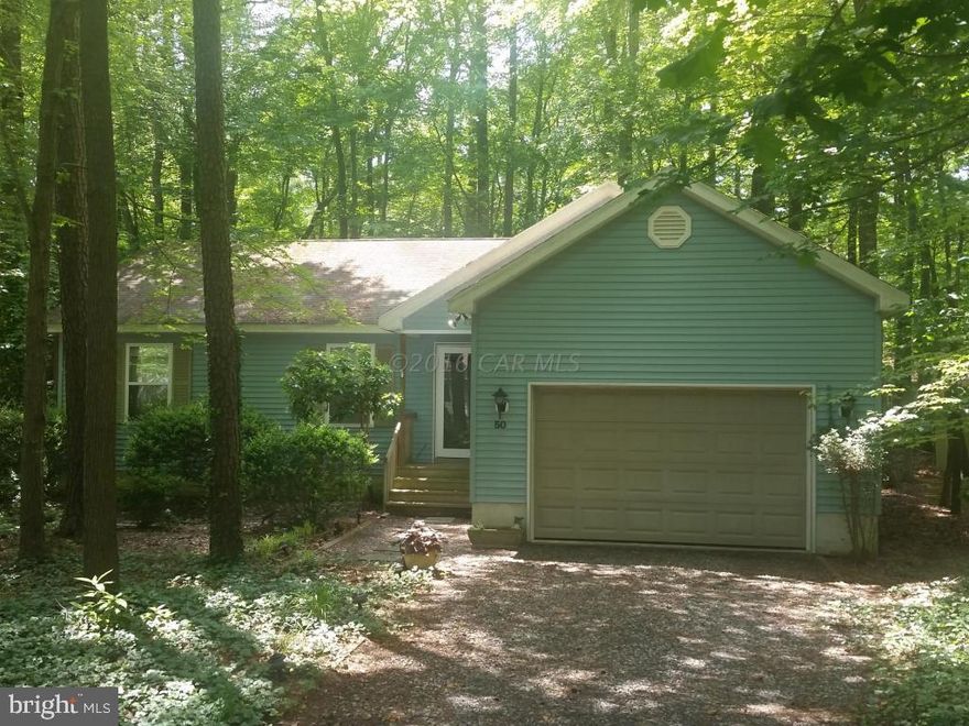 Great Value in Ocean Pines! 3 Bedrooms and 2 baths not far from the North Gate. High vaulted ceilings and a sun room. Large amount of storage in the attic and attached garage.